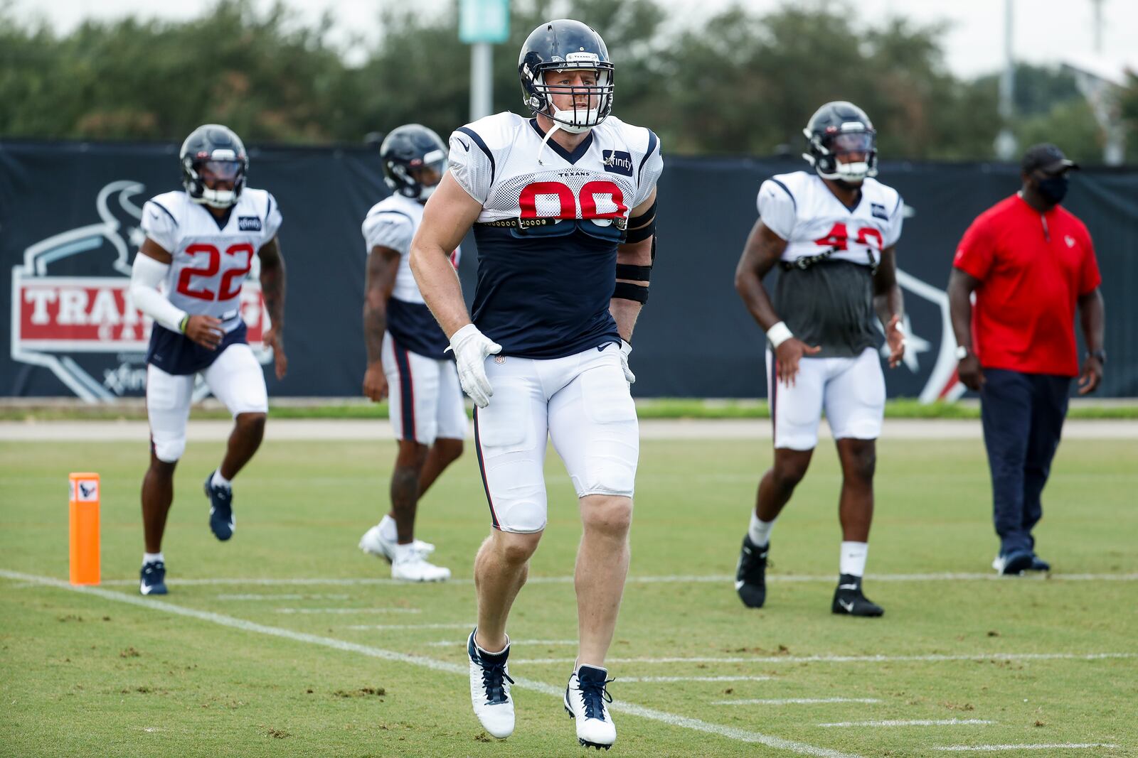 Houston Texans defensive end J.J. Watt (99) warms up during an NFL training camp football practice Monday, Aug. 24, 2020, in Houston. (Brett Coomer/Houston Chronicle via AP, Pool)