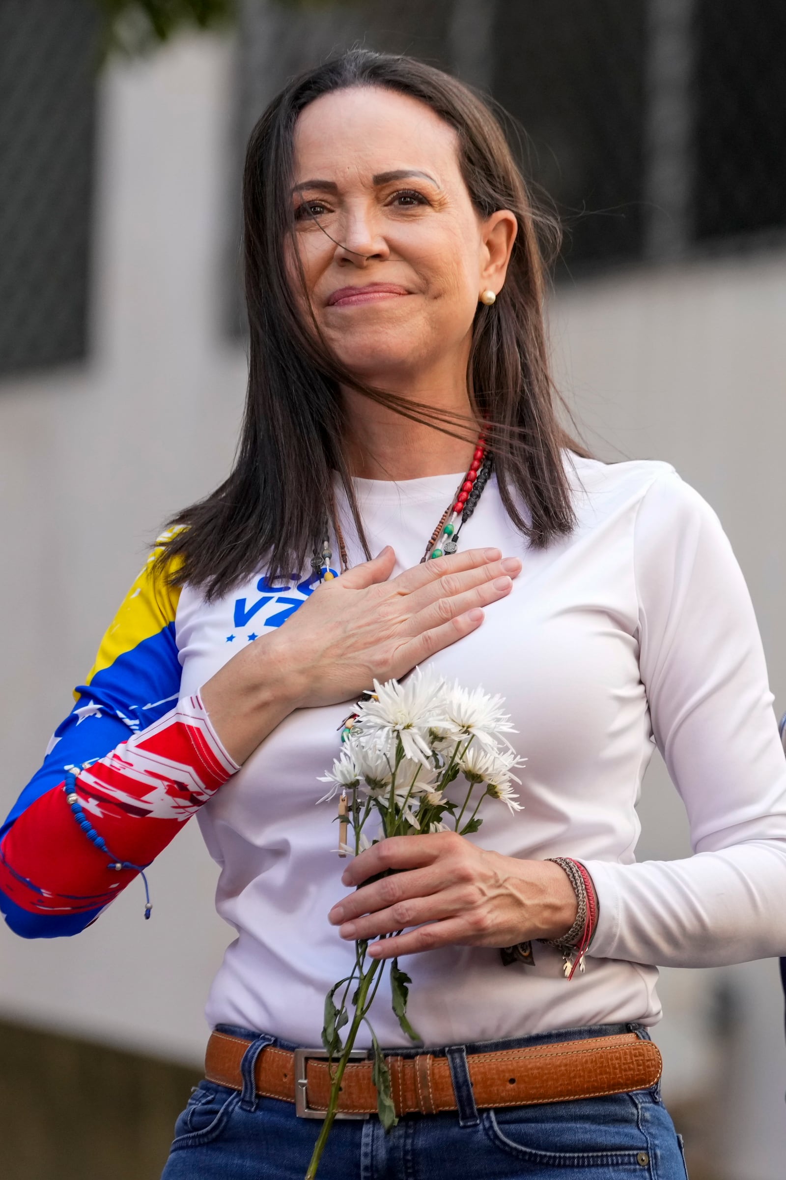 Opposition leader Maria Corina Machado gestures to supporters during a protest against President Nicolas Maduro the day before his inauguration for a third term, in Caracas, Venezuela, Thursday, Jan. 9, 2025. (AP Photo/Ariana Cubillos)