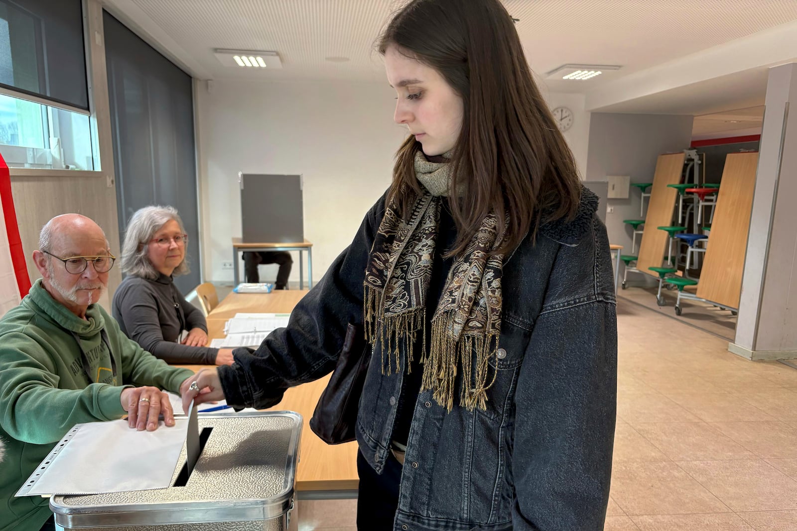 Gesa Schoenwolff, right, casts her vote at a polling station in Berlin, Germany, Sunday, Sept. 23, 2025, during the German national election. (AP Photo/Philipp-Moritz Jenne)