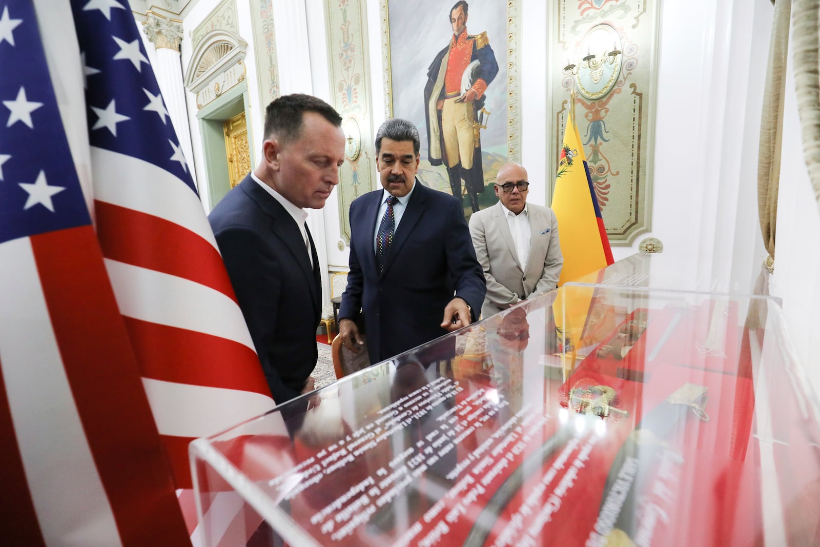 This photo released by Venezuela's presidential press office shows Venezuelan President Nicolas Maduro, center, with Richard Grenell, President Donald Trump's special envoy, left, at Miraflores presidential palace in Caracas, Venezuela, Friday, Jan. 31, 2025. Behind, right, is Jorge Rodriguez, president of the National Assembly. (Venezuela's presidential press office, via AP)