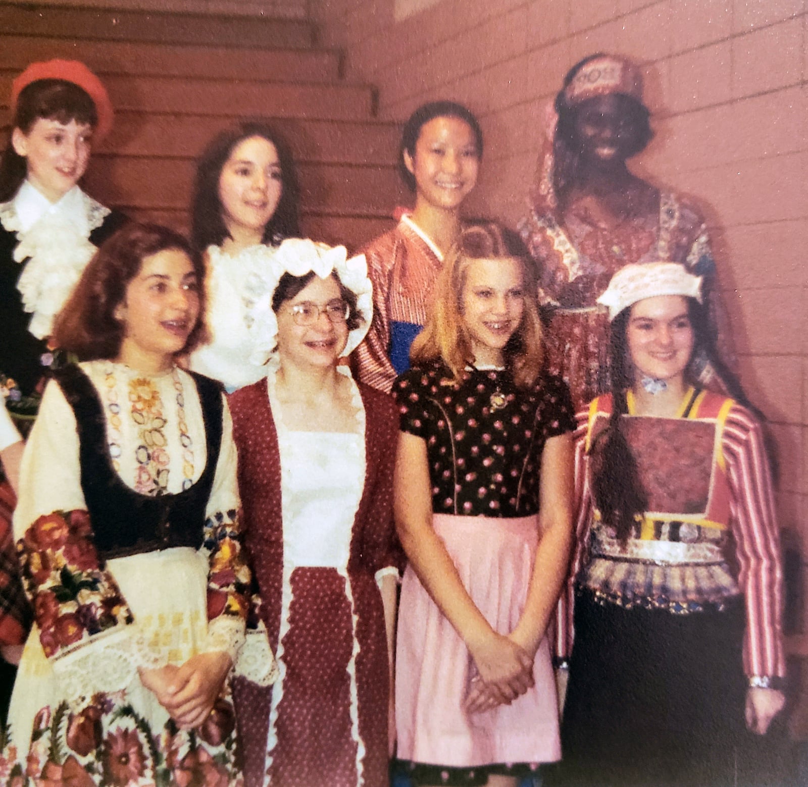 Sakar (front left) with the international dance group she joined in middle school. Most of the girls in the group are first generation Americans and are dressed in the authentic costume of their nations. Sakar continued to dance with these girls through adulthood.