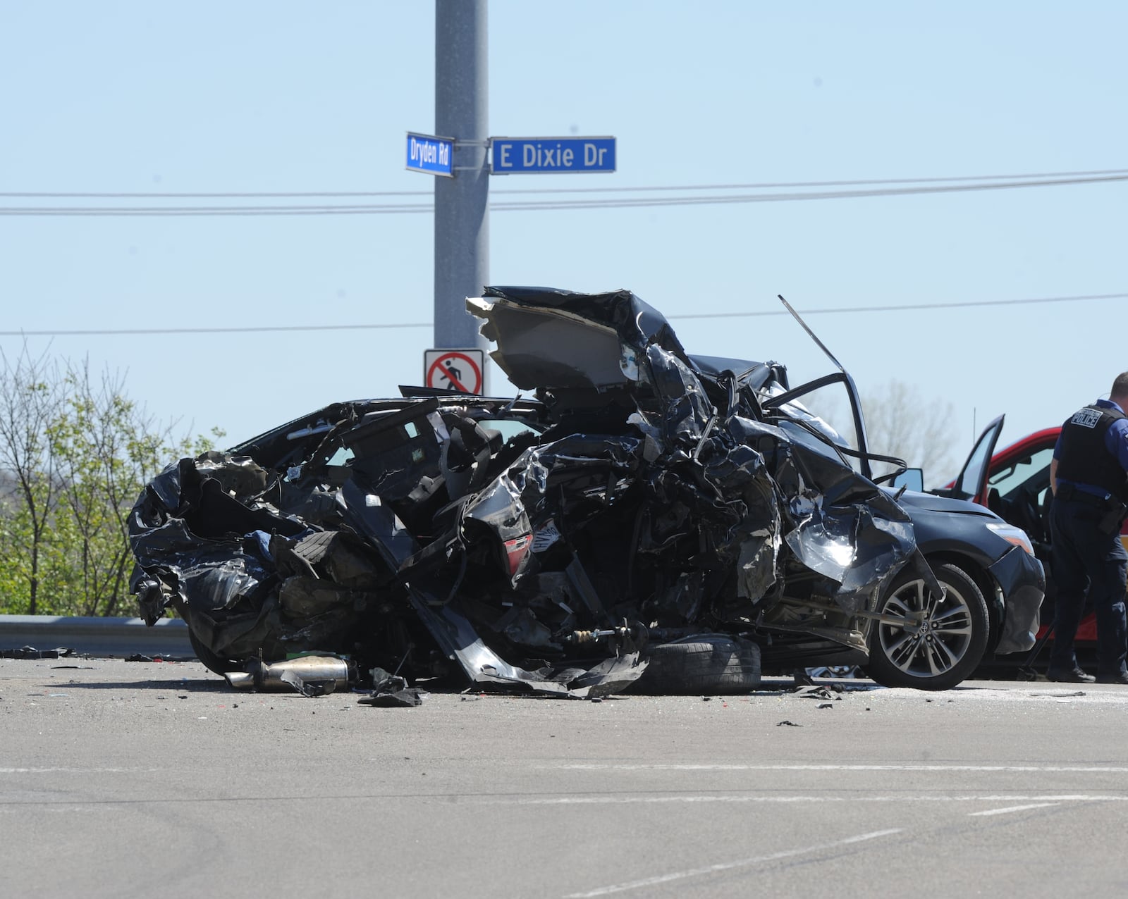 One person is dead following a two-vehicle crash Tuesday April 11, 2023, at the intersection of Dryden Road and East Dixie Drive/East Central Avenue in West Carrollton. MARSHALL GORBY \STAFF