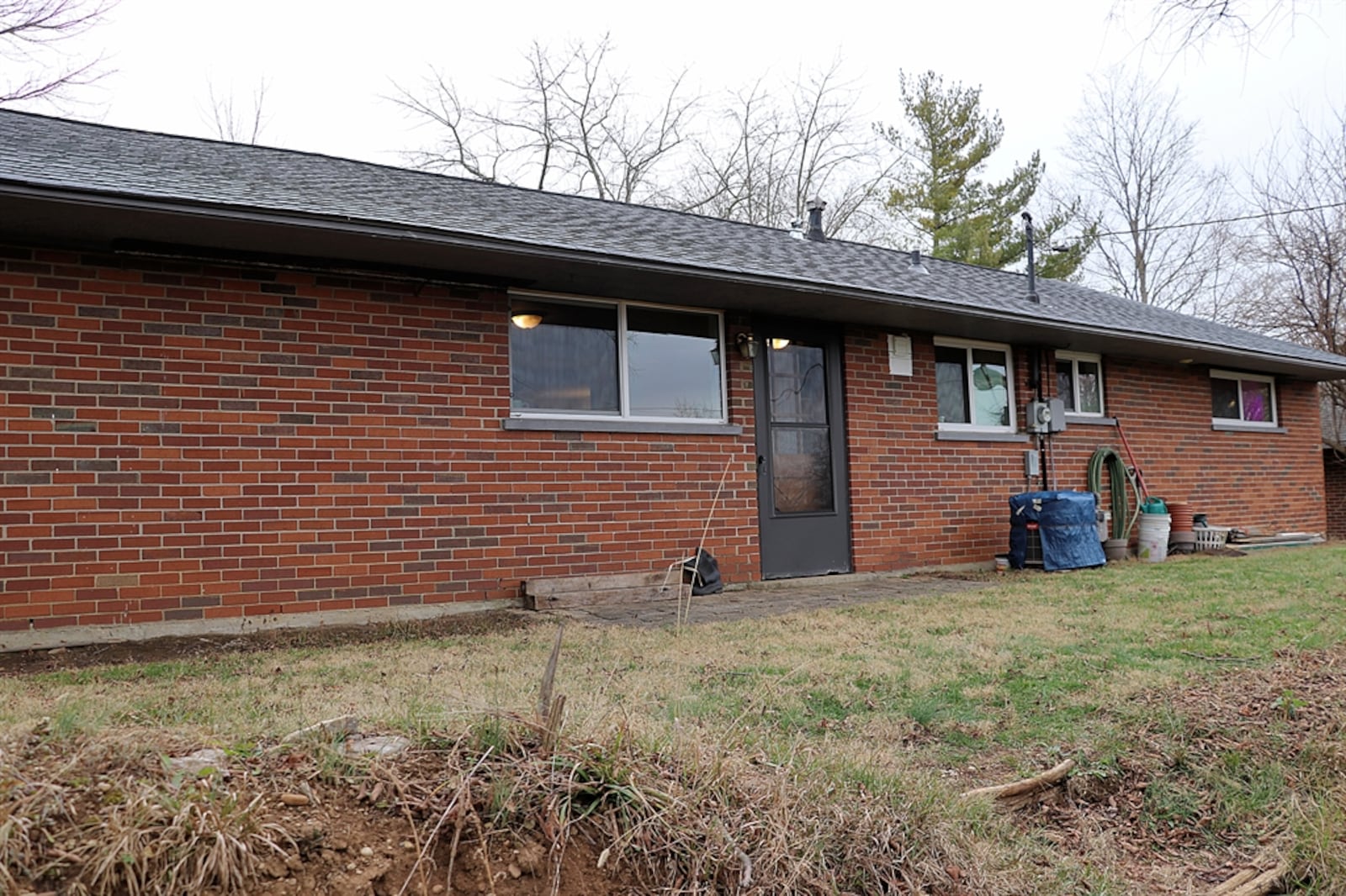 A door off the dining room opens to the backyard with a paver-stone patio.