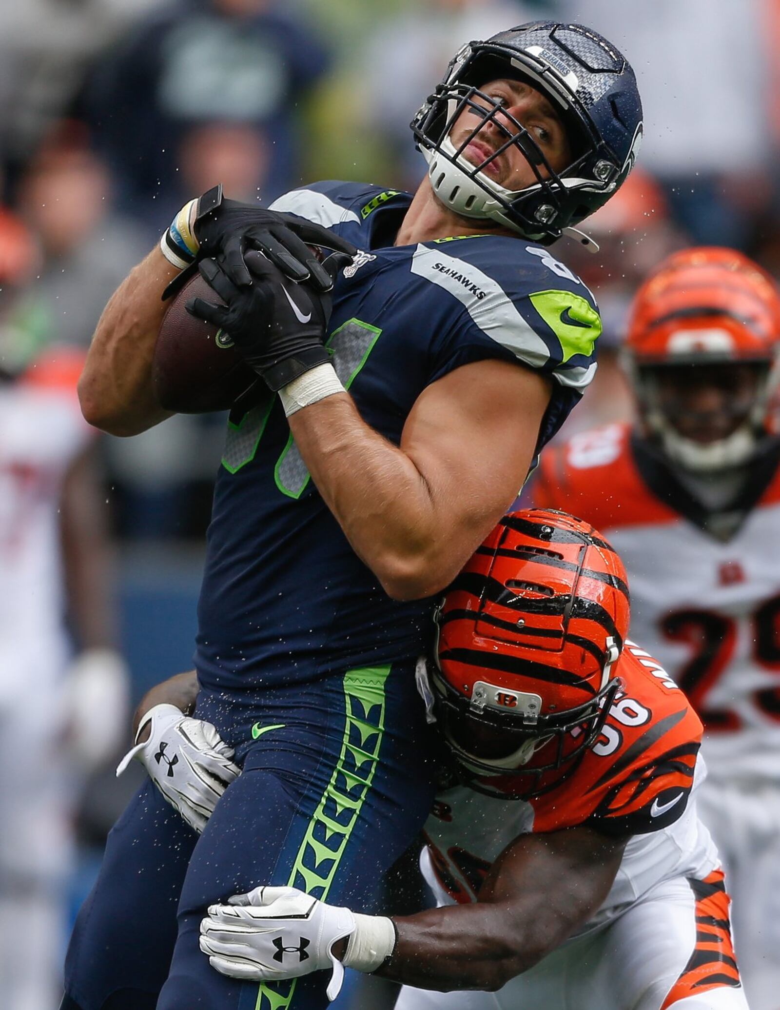 SEATTLE, WA - SEPTEMBER 08: Tight end Nick Vannett #81 of the Seattle Seahawks rushes against safety Shawn Williams #36 of the Cincinnati Bengals at CenturyLink Field on September 8, 2019 in Seattle, Washington. (Photo by Otto Greule Jr/Getty Images)