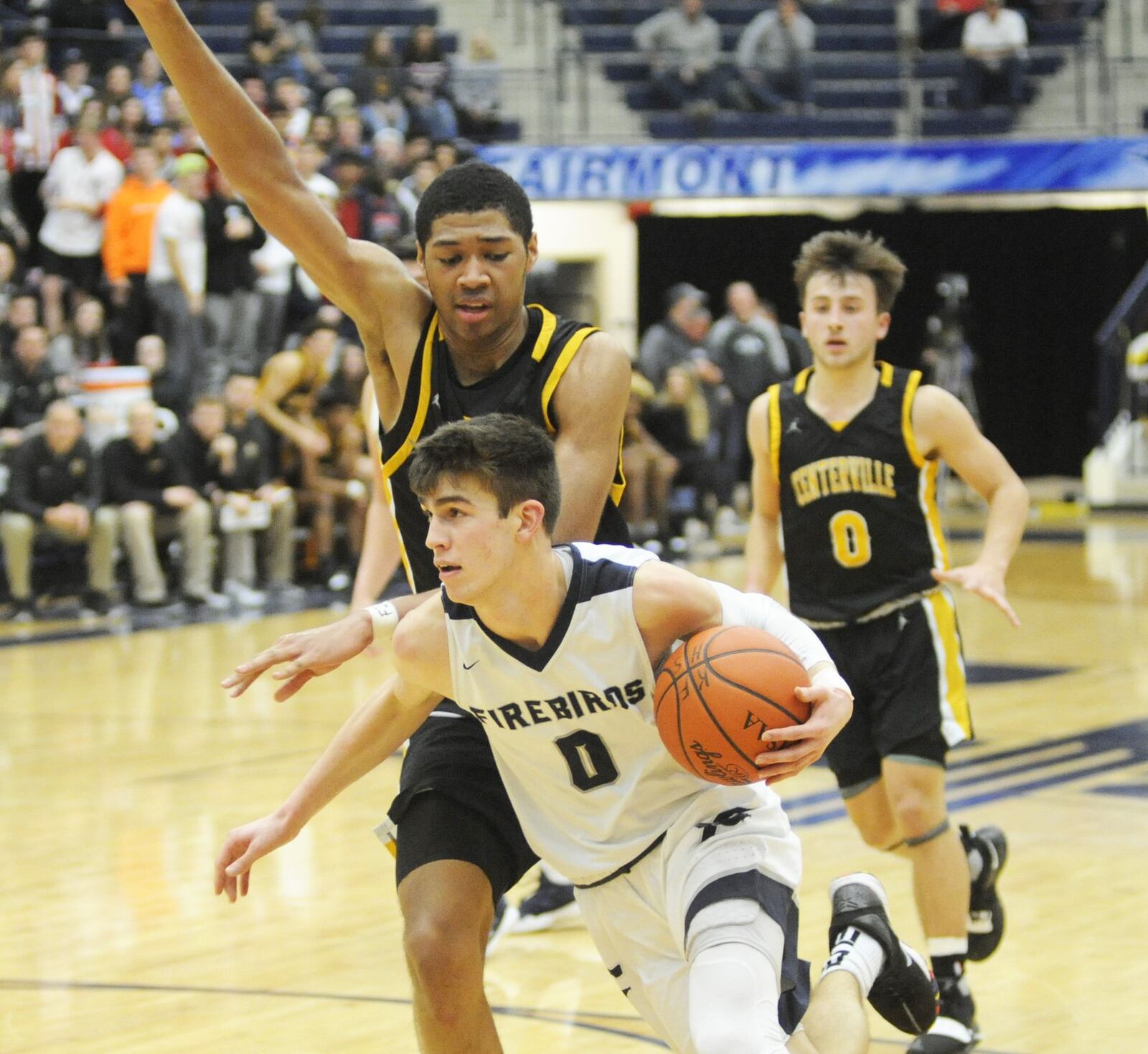 Ryan Hall of Fairmont (with ball) beats Mo Njie of Centerville. Mo Centerville defeated Fairmont 46-44 in a boys high school basketball game at Trent Arena on Friday, Feb. 8, 2019. MARC PENDLETON / STAFF