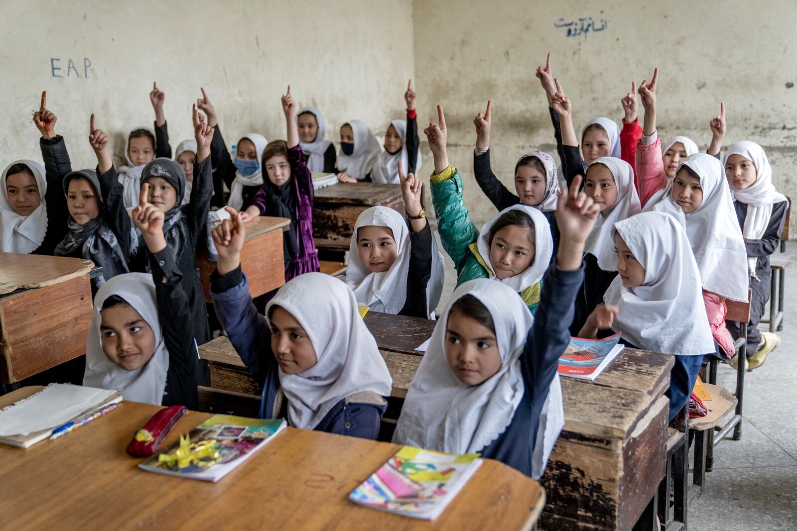 FILE -FILE - Afghan school girls attend their classroom on the first day of the new school year, in Kabul, Saturday, March 25, 2023. (AP Photo/Ebrahim Noroozi, File, File)