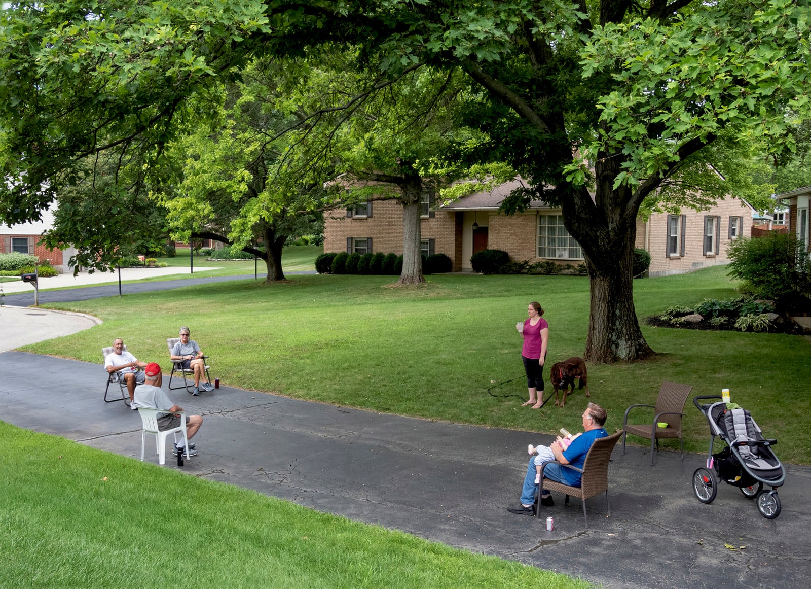 Kate Slonaker: "Distance Chat," one of the selected images highlighted in The Contemporary and Dayton Daily News collaboration "In the Balance: Reflections of Our Community During COVID."
In this photograph taken in March, neighbors learned to chat together following social distancing.