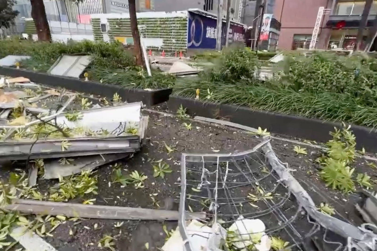 In this image taken from video by Taiwan's TVBS, the debris are strewn across the streets in the aftermath of an explosion at the Shin Kong Mitsukoshi department store in Taichung city in Taiwan on Thursday, Feb .13, 2025. (TVBS via AP)