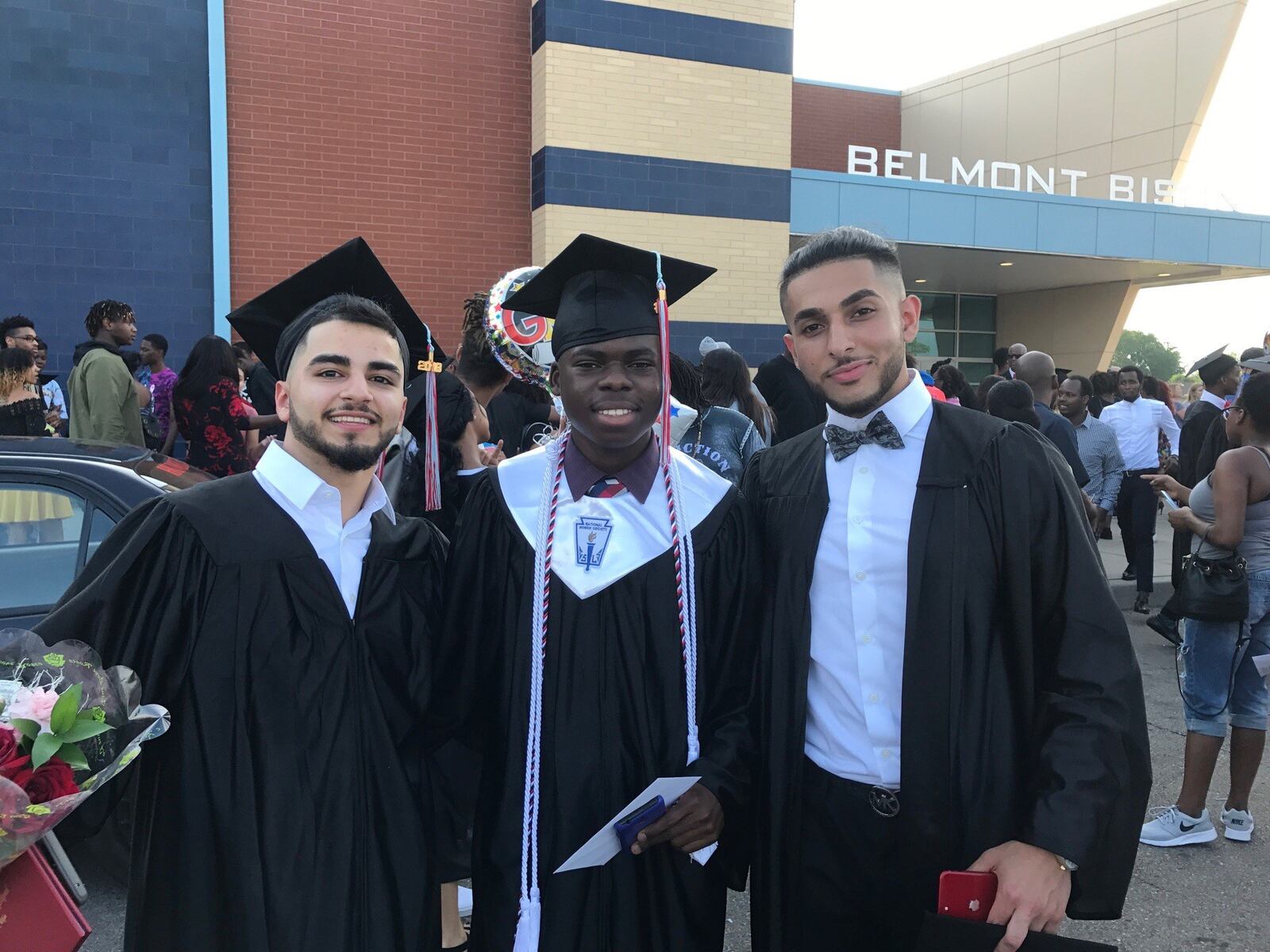 Bibebibyo Seko with two of his soccer teammates who also graduated. From left, Nyaz Ibrahim, Bibe and Ameer Al Zehhaw. TOM ARCHDEACON / STAFF