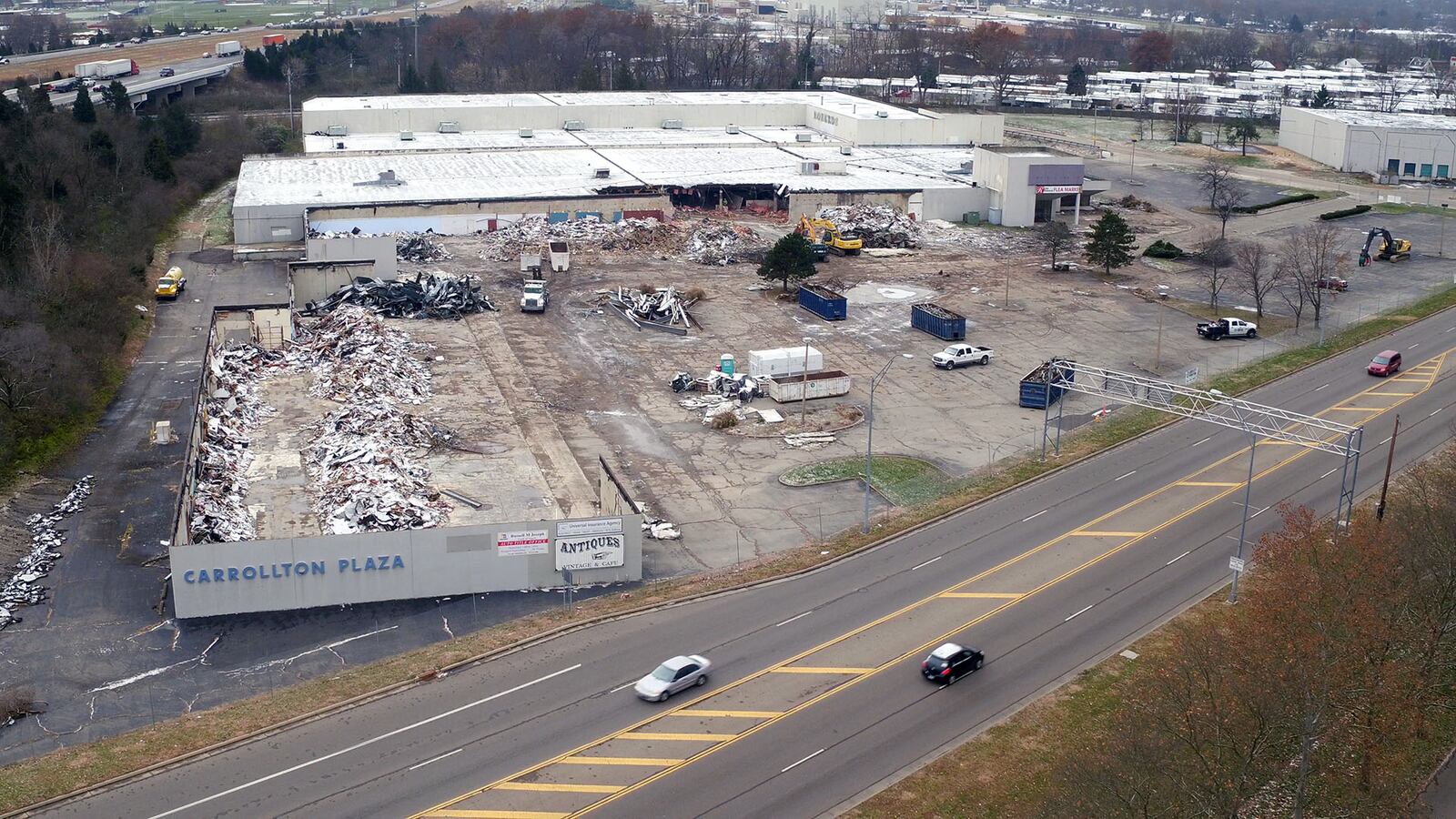 The Carrollton Plaza and Roberd's furniture and appliance store are being demolished to make way for a potential entertainment district the City of West Carrollton would like to have built on the site.  TY GREENLEES / STAFF