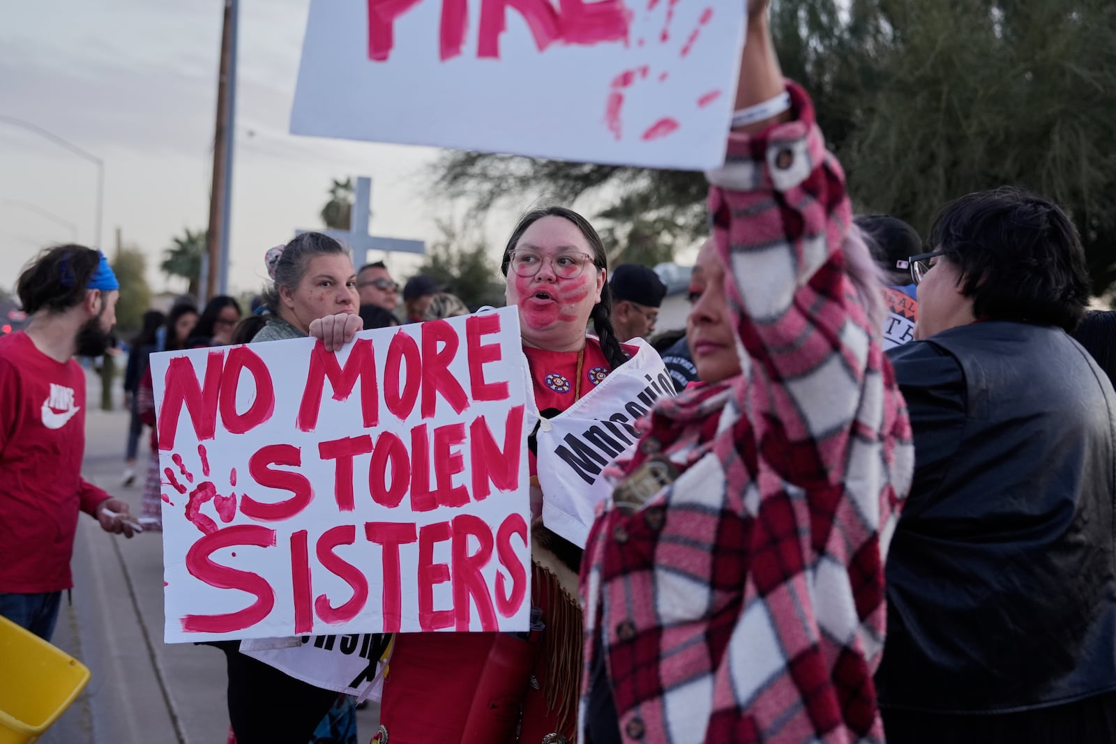 People attend a vigil for Native American teen Emily Pike, who was found dead, in Mesa, Ariz., Thursday, March 6, 2025. (AP Photo/Samantha Chow)