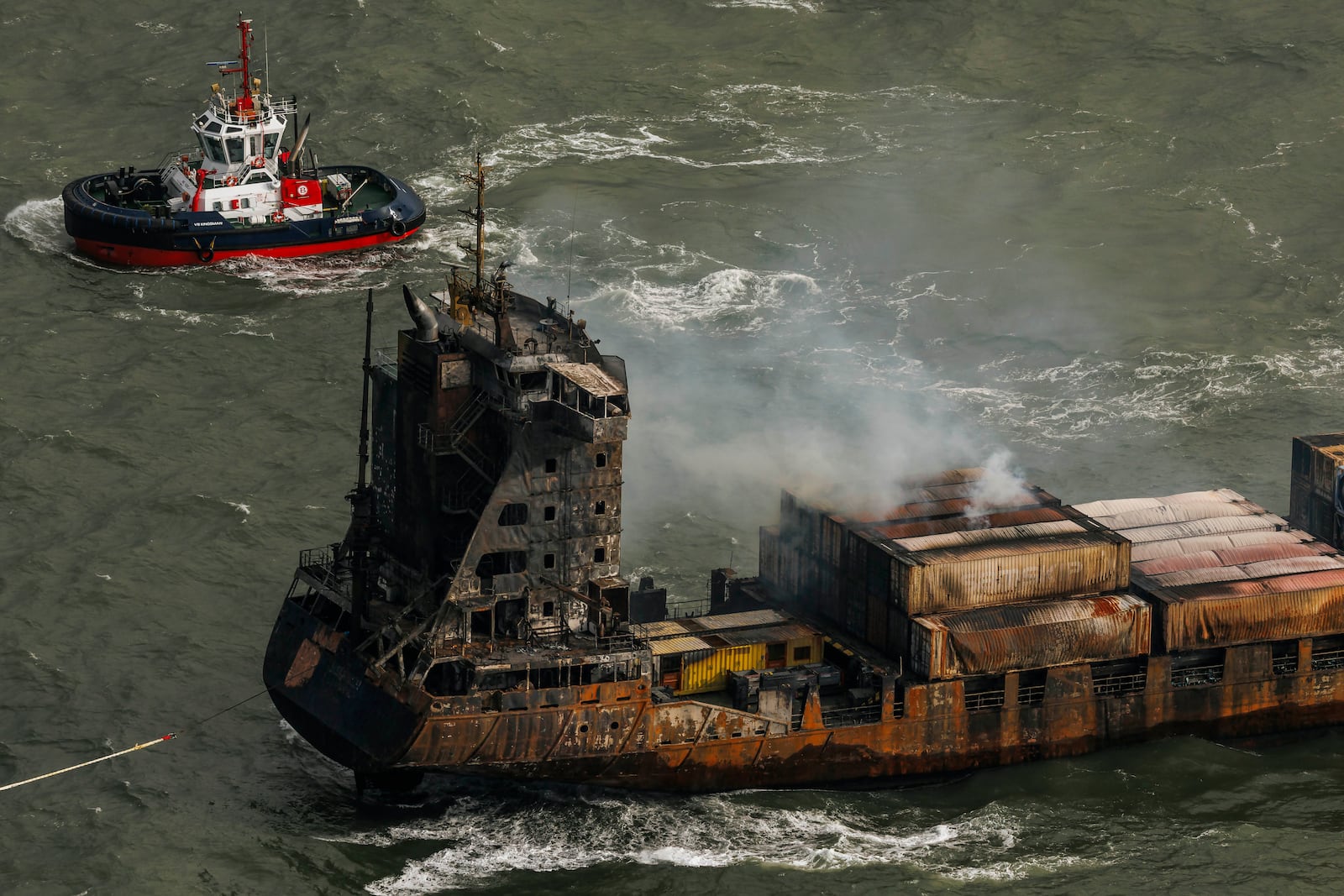 Smoke billows from the MV Solong cargo ship in the North Sea, off the Yorkshire coast in England, Tuesday, March 11, 2025. (Dan Kitwood/Pool Photo via AP)