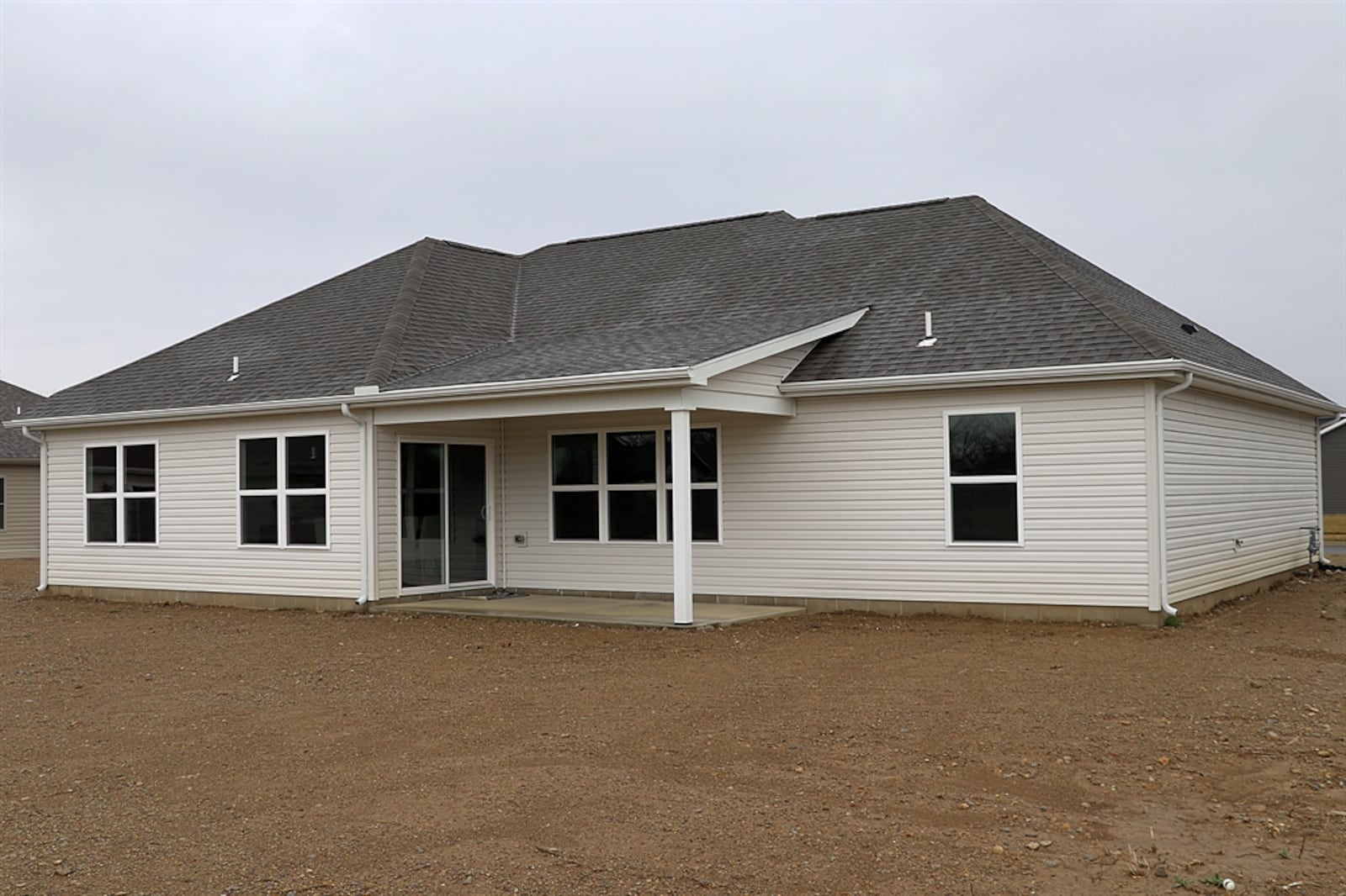 The new construction at 265 Fox Harbor Drive has about 1,762 square feet of living space. Built in 2023 by S.M. O’Neal Construction, the stone-and-vinyl ranch has craftsman-style gable truss accents and a stained overhead door to the two-car garage. A concrete driveway leads to a concrete walkway to the covered entry nook. Landscaping and sod will be added in spring. CONTRIBUTED