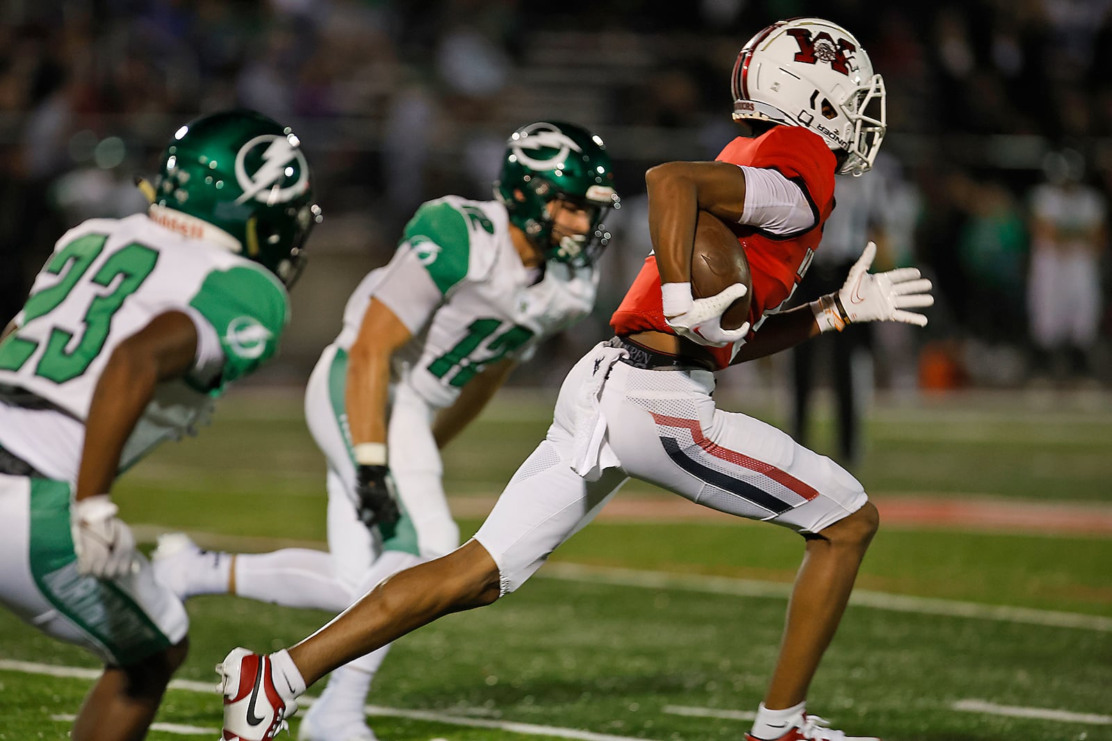 Wayne's Jussiah Williams-West carries a Northmont kickoff back for a touchdown. BILL LACKEY/STAFF