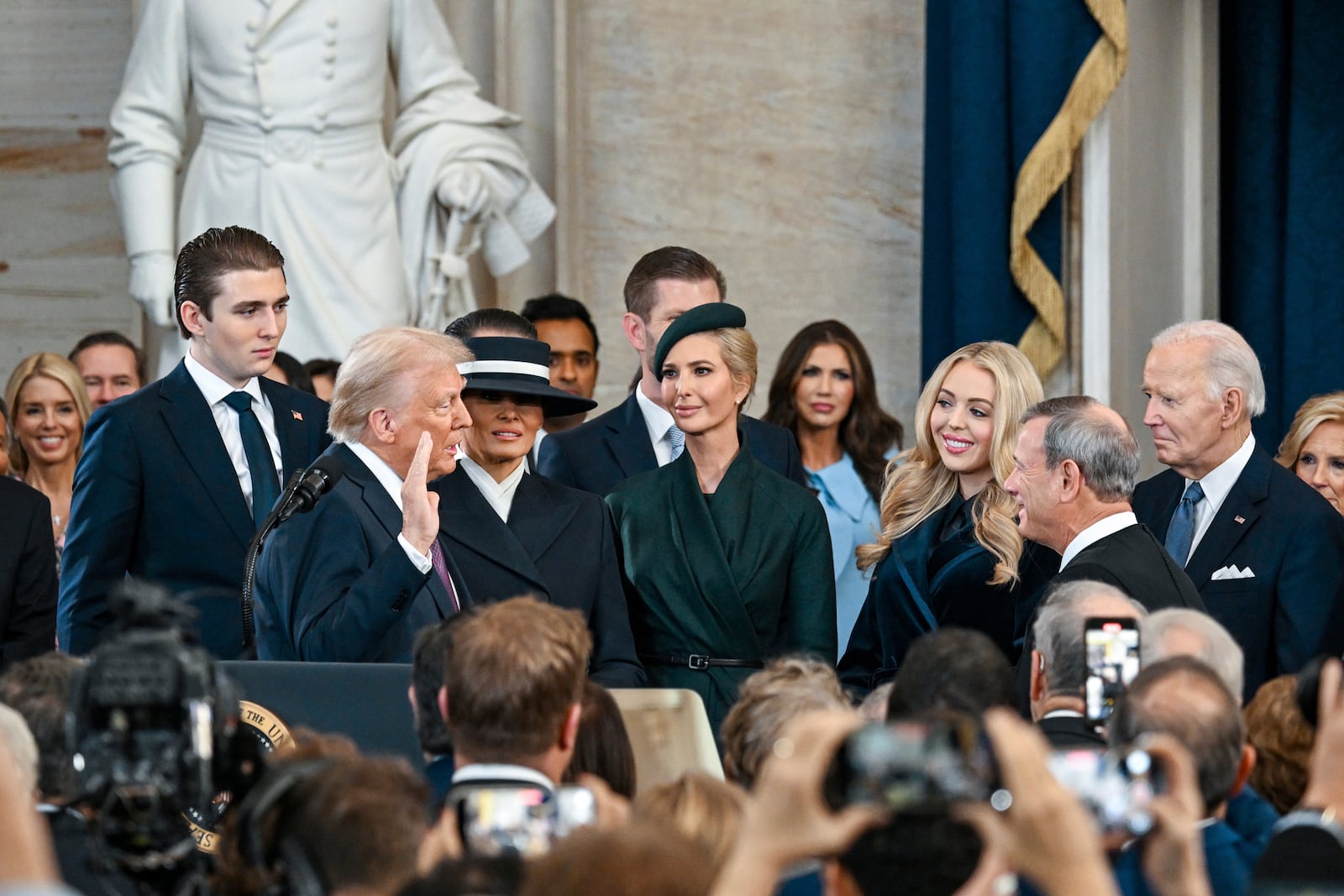 President-elect Donald Trump, center left, takes the oath of office during the 60th Presidential Inauguration in the Rotunda of the U.S. Capitol in Washington, Monday, Jan. 20, 2025. (Kenny Holston/The New York Times via AP, Pool)