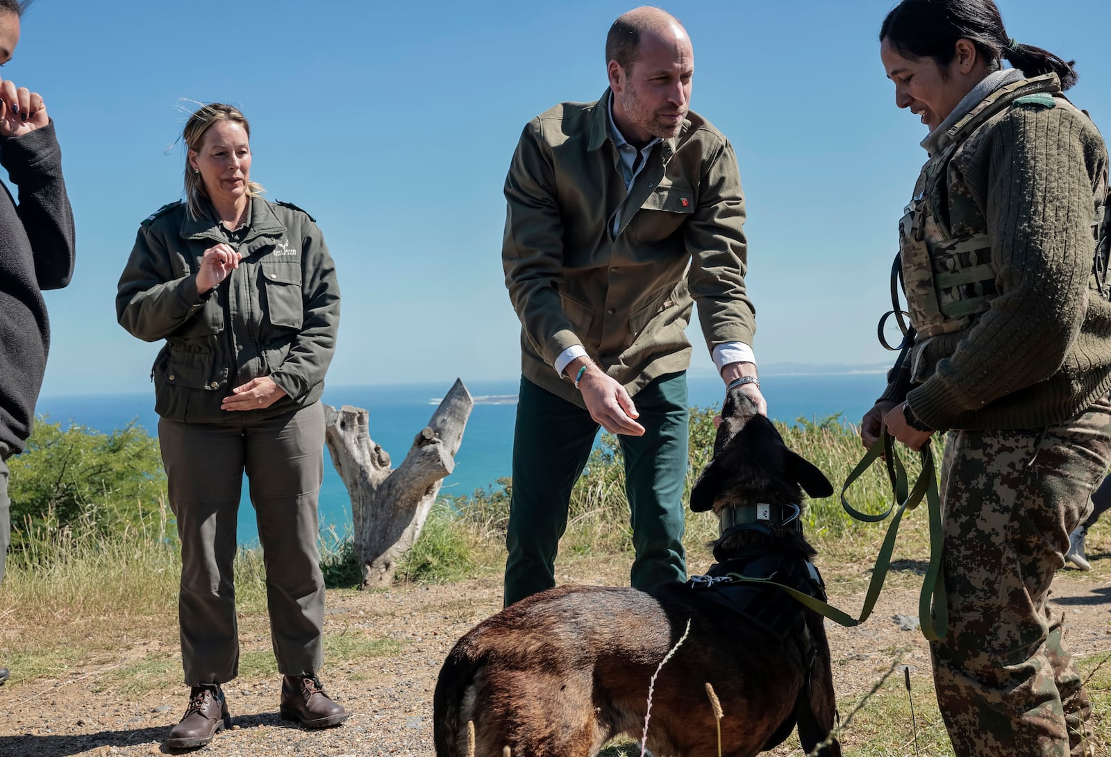 Britain's Prince William, center, meets with Park Manager for Table Mountain National Park Megan Taplin, third right, and other rangers while visiting Signal Hill in Cape Town, South Africa, Tuesday, Nov. 5, 2024. (Gianluigi Guercia/Pool via AP)