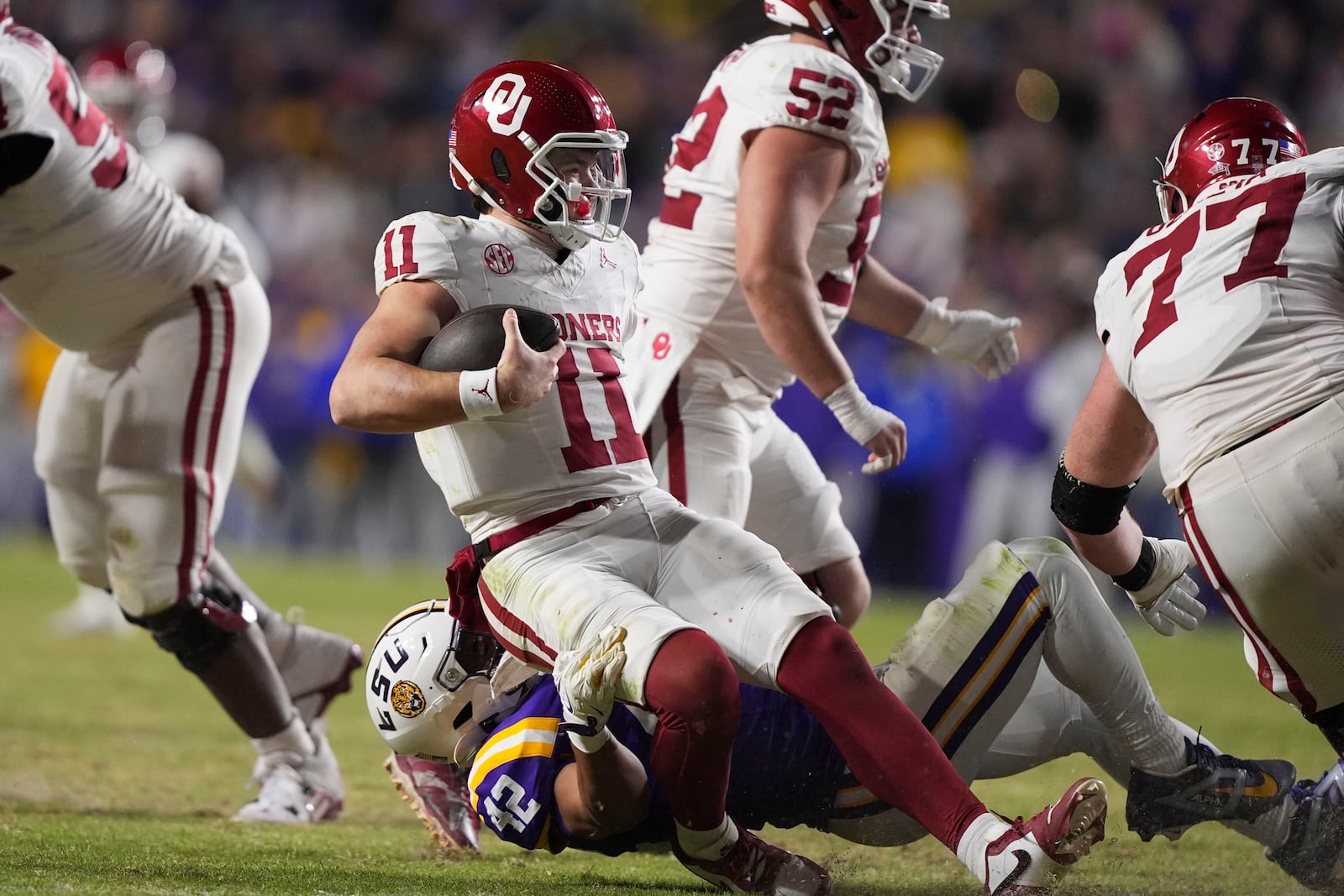 Oklahoma quarterback Jackson Arnold (11) is sacked by LSU linebacker Davhon Keys (42) in the second half an NCAA college football game in Baton Rouge, La., Saturday, Nov. 30, 2024. LSU won 37-17. (AP Photo/Gerald Herbert)