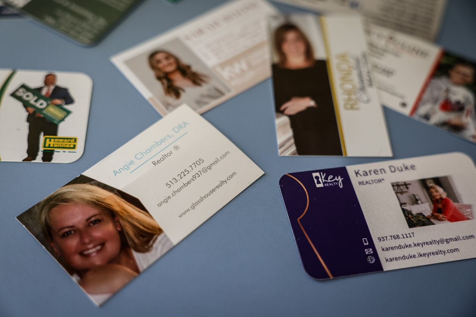 Real estate agents leave their business cards at a Beavercreek home that is on the market. JIM NOELKER/STAFF