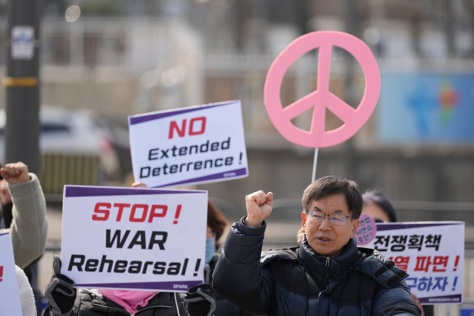 Protesters shout slogans during a press conference demanding to stop the upcoming Freedom Shield military exercise between the U.S. and South Korea, near the Defense Ministry in Seoul, South Korea, Monday, March 10, 2025. (AP Photo/Lee Jin-man)