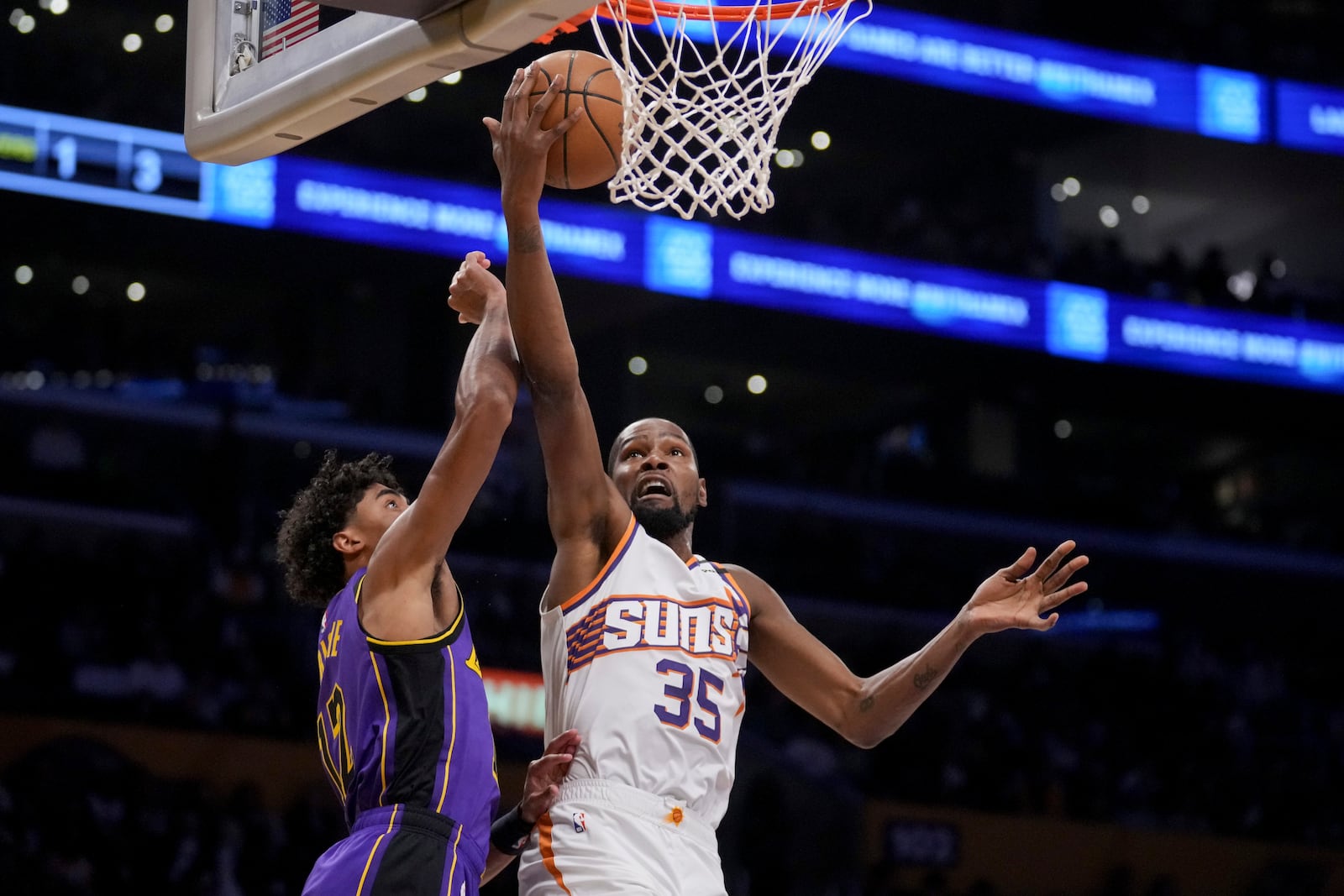 Phoenix Suns forward Kevin Durant (35) goes to the basket against Los Angeles Lakers guard Max Christie (12) during the first half of an NBA basketball game against the in Los Angeles, Friday, Oct. 25, 2024. (AP Photo/Eric Thayer)