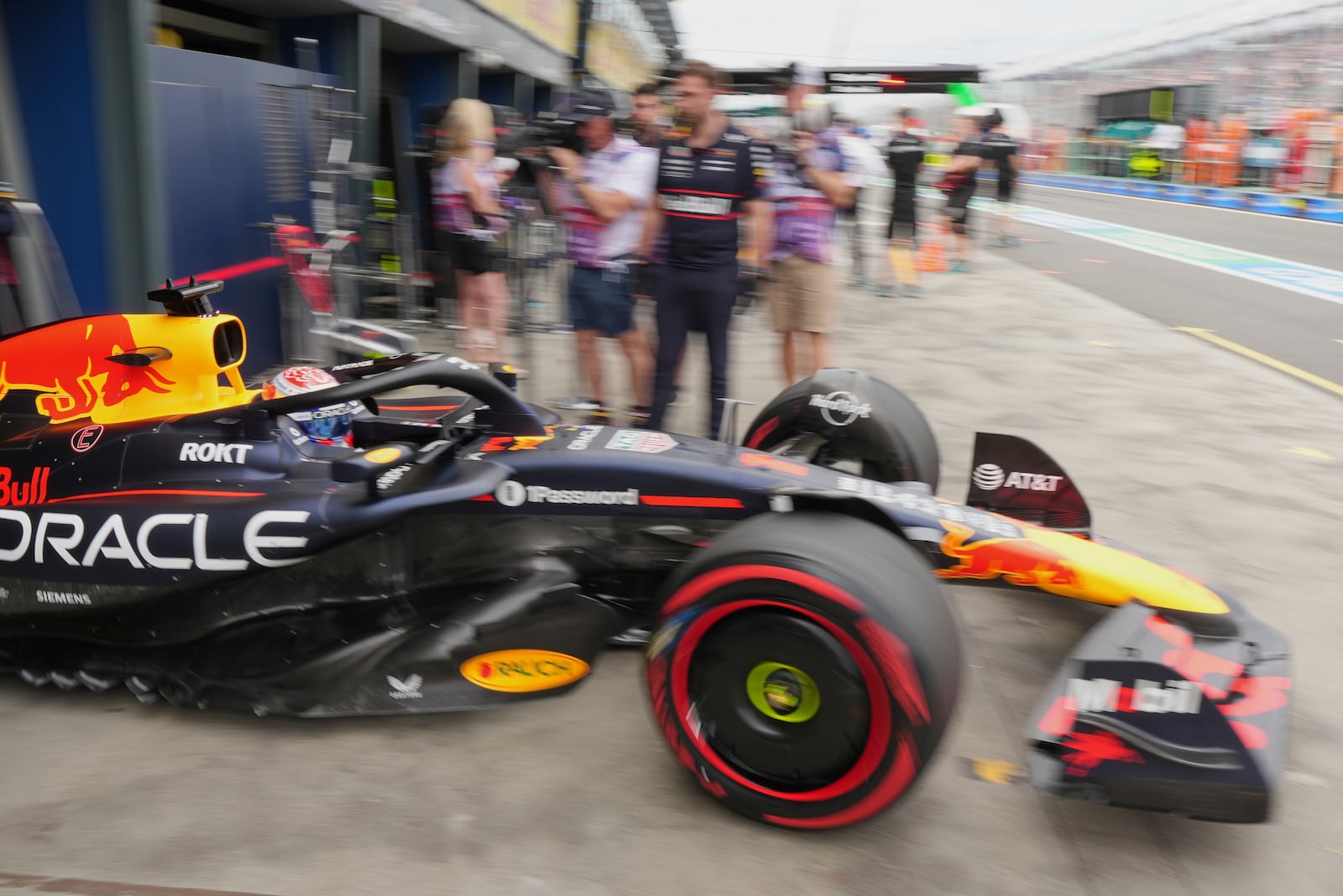 Red Bull driver Max Verstappen of the Netherlands steers his car out of his team garage during the third practice session at the Australian Formula One Grand Prix at Albert Park, in Melbourne, Australia, Saturday, March 15, 2025. (AP Photo/Scott Barbour)