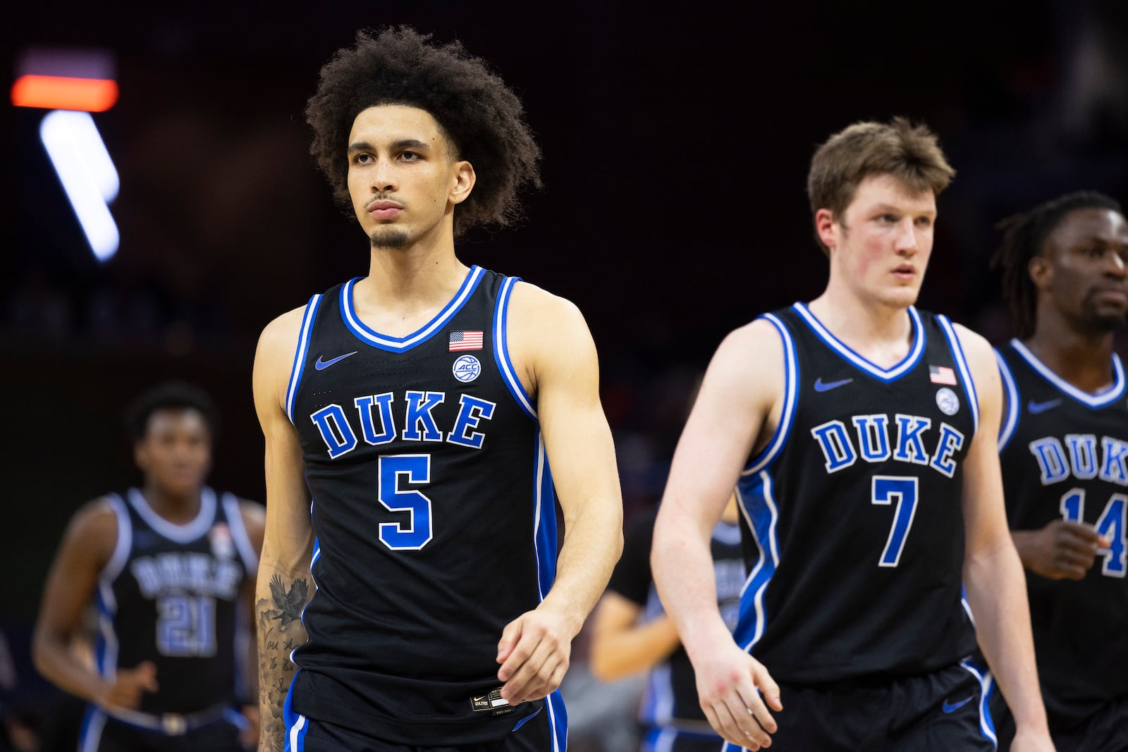 Duke guard Tyrese Proctor (5) and guard Kon Knueppel (7) walk out on the court with their teammates during the second half of an NCAA college basketball game against Virginia, Monday, Feb. 17, 2025, in Charlottesville, Va. (AP Photo/Mike Kropf)