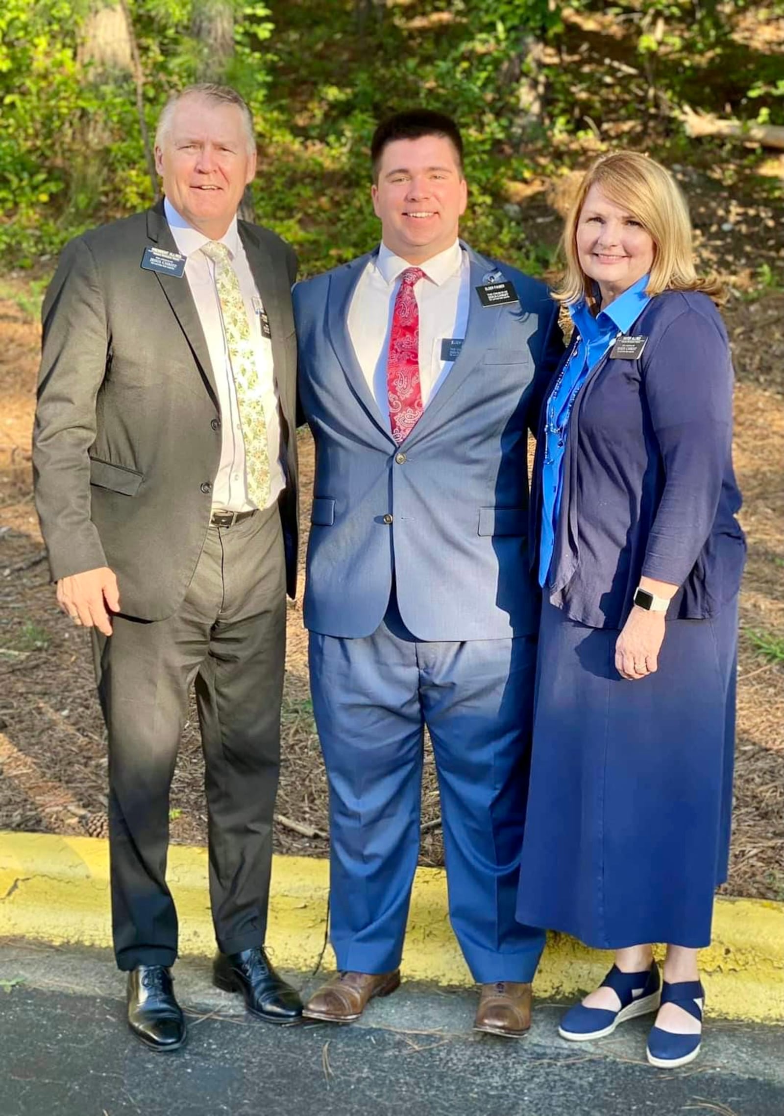 Michael Fauber, center, with The Church of Jesus Christ of Latter-day Saints Alabama Birmingham Mission President Chad W. Allred and Sister Melanie Allred. Photo courtesy the Fauber family.