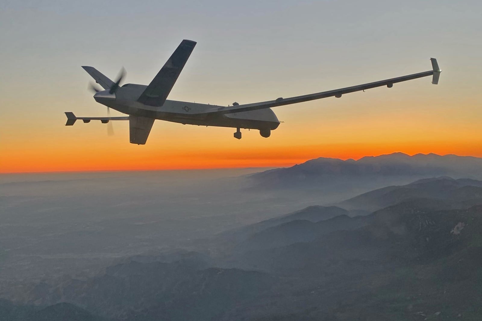 
                        A photo provided by the U.S. Air Force shows an MQ-9 Reaper drone over the San Gabriel Mountains of southern California in late August 2020. A Russian warplane on Tuesday, March 14, 2023, intercepted a U.S. surveillance MQ-9 Reaper drone over the Black Sea, striking the drone’s propeller and forcing it down in international waters, according to U.S. European Command, which called the incident “unsafe and unprofessional.” (U.S. Air Force via The New York Times)  — NO SALES; EDITORIAL USE ONLY—
                      