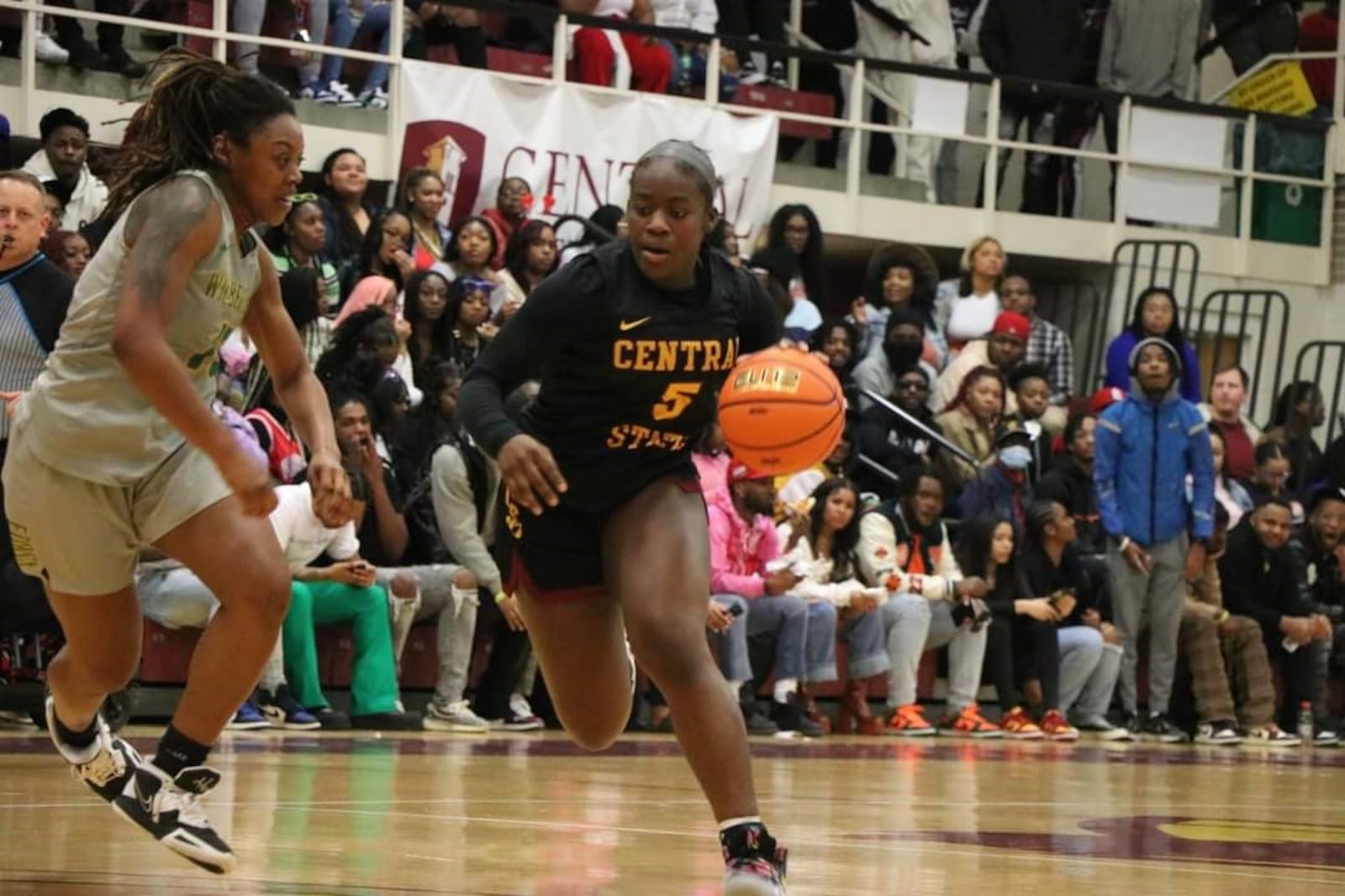 Central State’s senior guard Laurene  Tere drives on Wilberforce’s Raven Willis in the Marauders 77-61 victory Tuesday night at Beacom/Lewis Gym. CSU Athletics photo