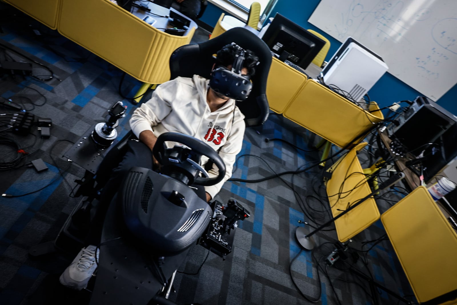 University of Dayton grad student Saikiran Kopla plays a virtual reality game he and his fellow students created in the VR science lab Thursday October 17, 2024. JIM NOELKER/STAFF