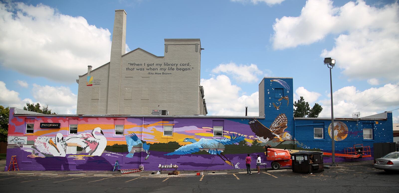 A new large-scale mural with an outdoor theme is underway on the south side of the Printpoint Printing building, 150 S. Patterson Blvd. The mural, entitled "Twilight," is designed by artist Gae Helton. It is being produced by the K12 Gallery & TEJAS and artists in the Montgomery County Juvenile Court's HAALO Program. LISA POWELL / STAFF