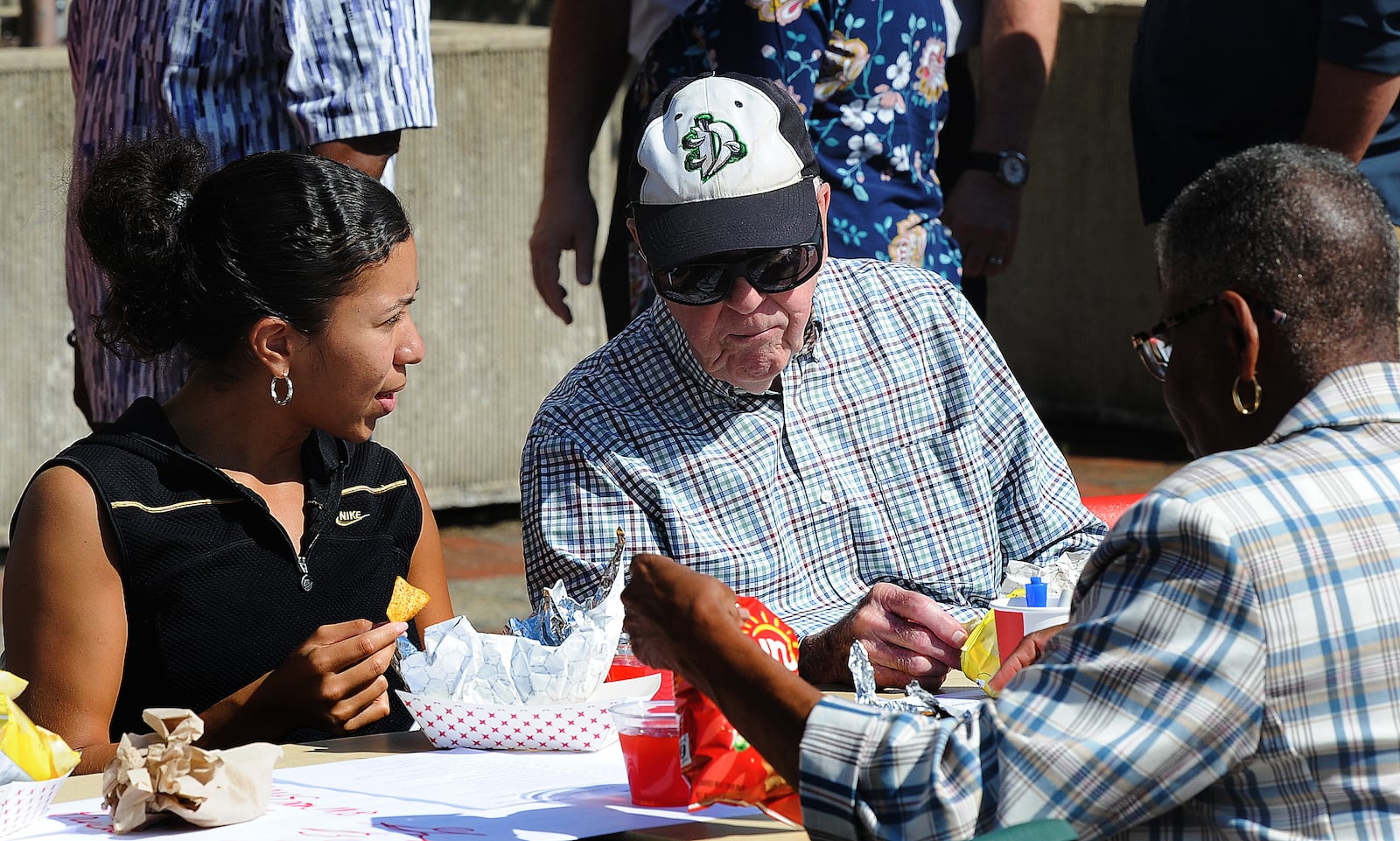 Taylor Johnson, left and Jim Evans, talk while enjoying lunch at  the longest table event at Sinclair College, Wednesday, Sept. 20, 2023. People from all over the city enjoyed a free meal while engaging in conversation about diverse perspectives and common goals. MARSHALL GORBY\STAFF