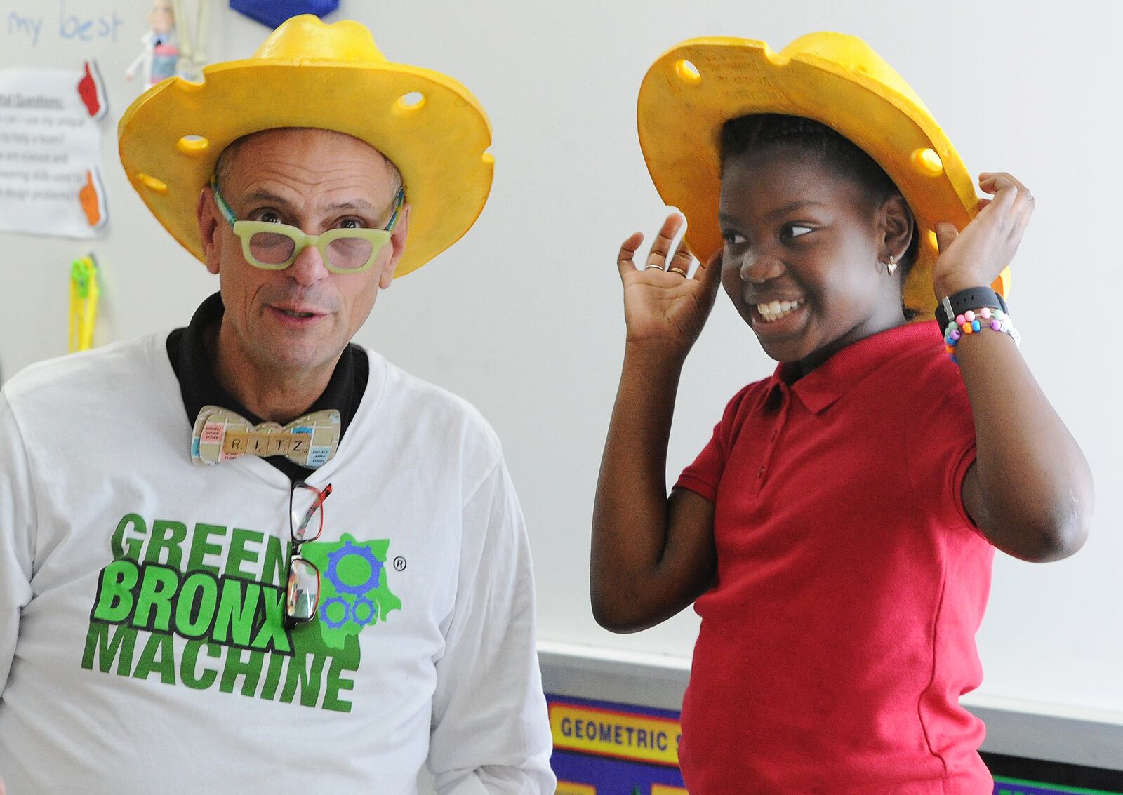 Green Bronx Machine founder Stephen Ritz talks with 4th grade student Olivia Scearce Thursday Sept. 15, 2022 at Westbrooke Village Elementary school in Trotwood.  MARSHALL GORBY\STAFF