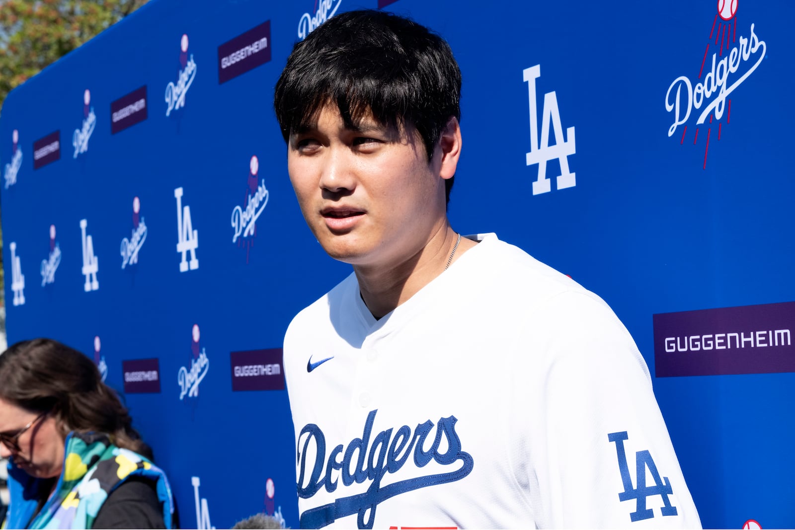 Los Angeles Dodgers' Shohei Ohtani talks to the media during a baseball interview during DodgerFest at Dodger Stadium, Saturday, Feb. 1, 2025, in Los Angeles. (AP Photo/Richard Vogel)