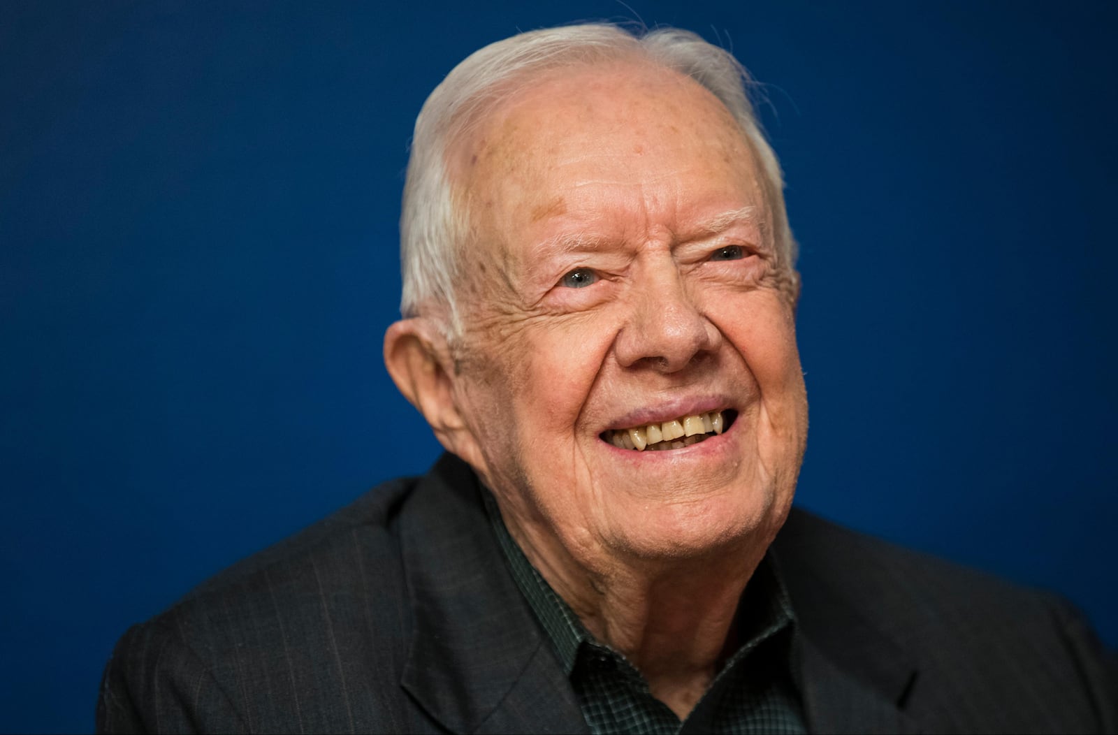 Former U.S. President Jimmy Carter smiles during a book signing event for his new book 'Faith: A Journey For All' at Barnes & Noble bookstore in Midtown Manhattan, March 26, 2018 in New York City. Carter, 93, has been a prolific author since leaving office in 1981, publishing dozens of books. (Photo by Drew Angerer/Getty Images)