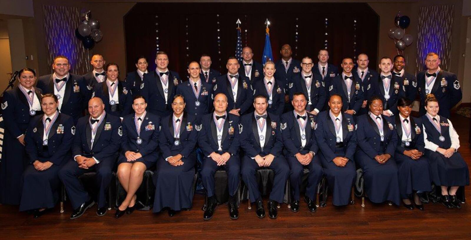 More than 30 new master sergeants and master sergeant selectees pose for a group photo Aug. 26 at the end of their senior NCO induction ceremony in the Wright-Patt Club. The ceremony honored the new senior NCOs of the 88th Air Base Wing and 13 tenant commands. U.S. AIR FORCE PHOTO/R.J. ORIEZ