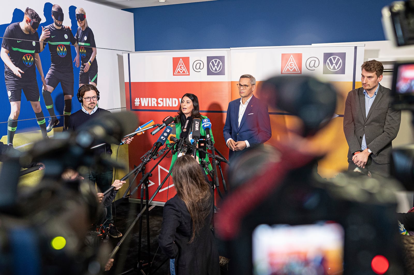 Daniela Cavallo, Chairwoman of the General and Group Works Council of Volkswagen AG, and Thorsten Gröger, District Manager of IG Metall, makes press statements before the start of the second collective bargaining negotiations between Volkswagen and IG Metall, in Wolfsburg, Germany, Wednesday, Oct. 30, 2024. (Moritz Frankenberg/dpa via AP)