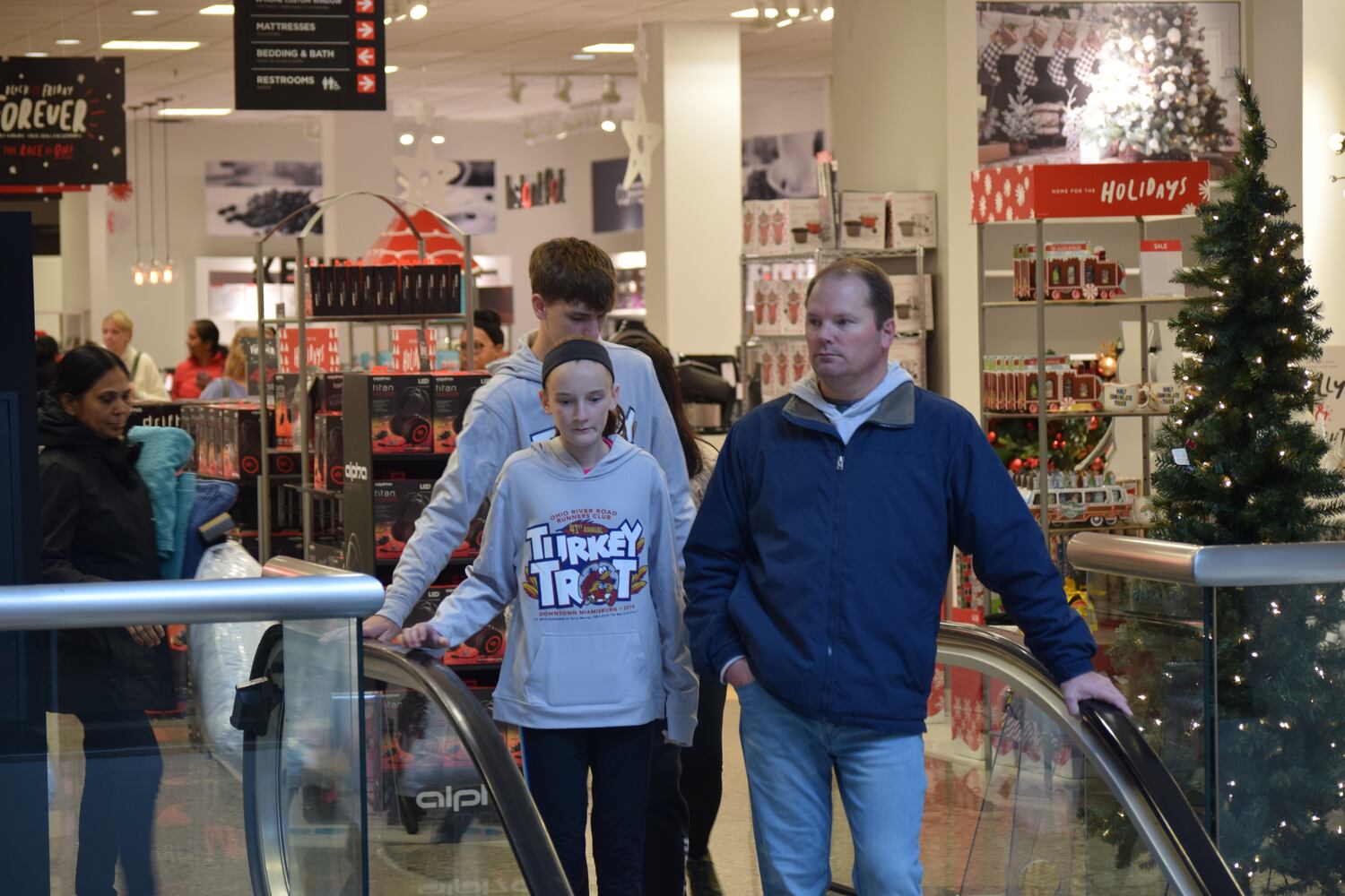 PHOTOS: Hundreds like up outside JCPenney for doorbusters, coupons