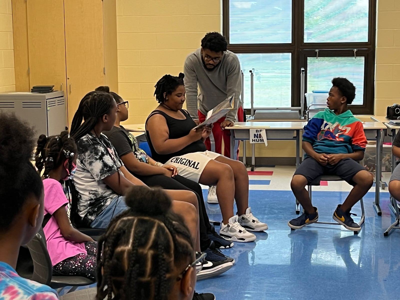 Students at Camp H.O.P.E. take turns reading a book related to their weekly theme. Camp H.O.P.E. is run by Omega CDC at Fairview Elementary and Edwin Joel Brown Middle School.