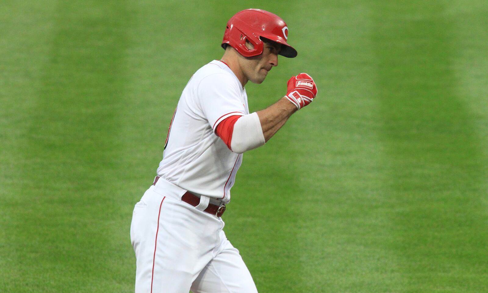 Joey Votto, of the Reds, celebrates after hitting a two-run home run against the Brewers on Wednesday, Sept. 23, 2020, at Great American Ball Park in Cincinnati. David Jablonski/Staff