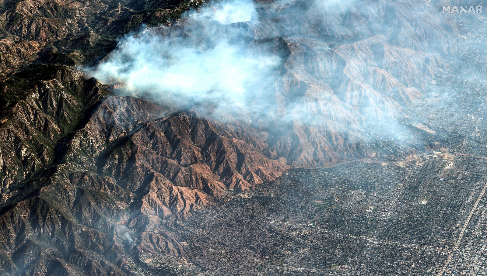 This satellite image provided by Maxar Technologies shows an aerial view of the Eaton Fire, in Calif., Friday, Jan. 10, 2025. (Maxar Technologies via AP)