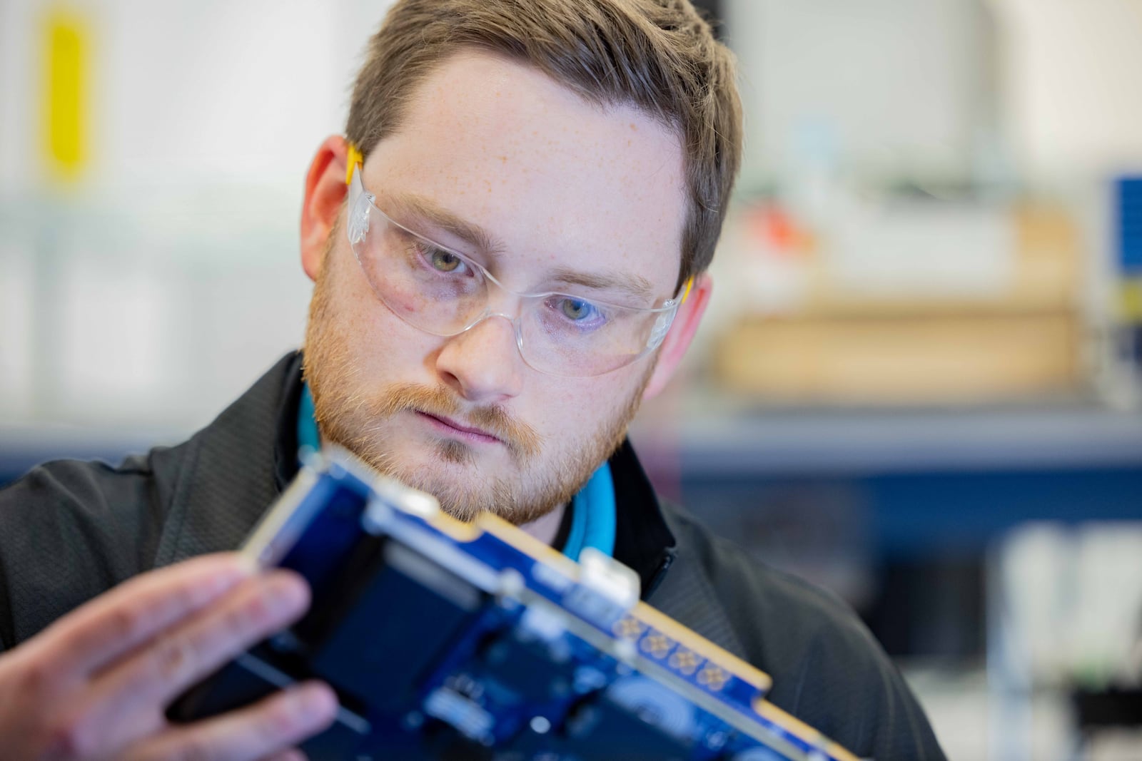 Jonathan Hoopes, GE Aerospace electronic hardware lead engineer, works on aircraft electrical power generation components Electrical Power Integrated Systems Center, or 
EPISCenter in Dayton. GE Aerospace’s investment into its Dayton area facilities in the past two years totals $53.7 million. CONTRIBUTED