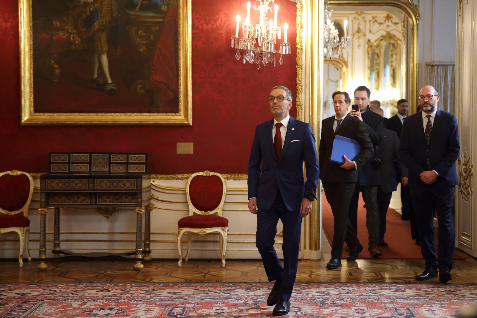 Head of the Freedom Party (FPOe) Herbert Kickl, center, arrives at the presidential office, in Vienna, Austria, Monday, Jan. 06, 2025. (AP Photo/Heinz-Peter Bader)