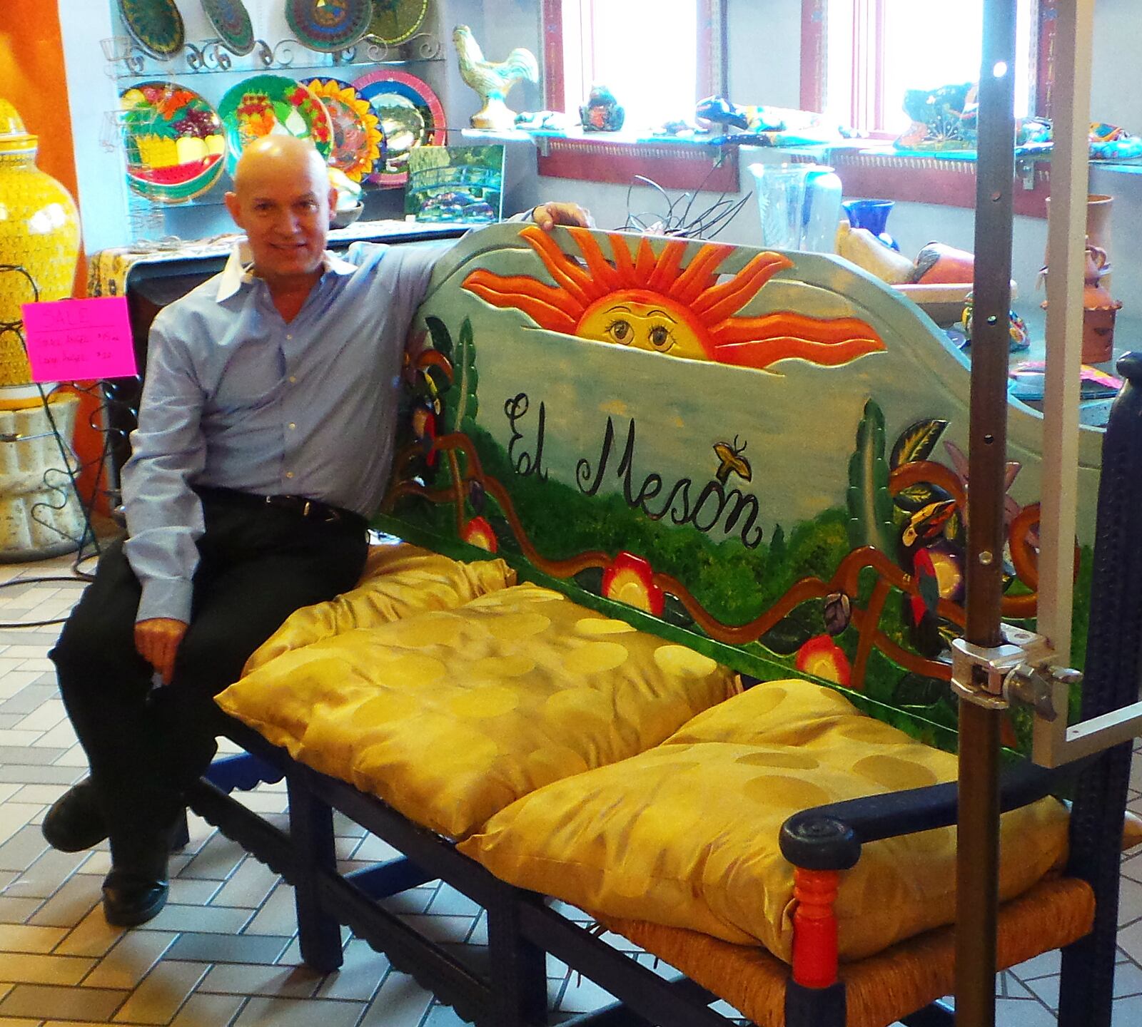 Bill Castro, co-owner of El Meson, sits in his restaurant's market area, where items including jewelry and pottery can be purchased. ALEXIS LARSEN/CONTRIBUTED