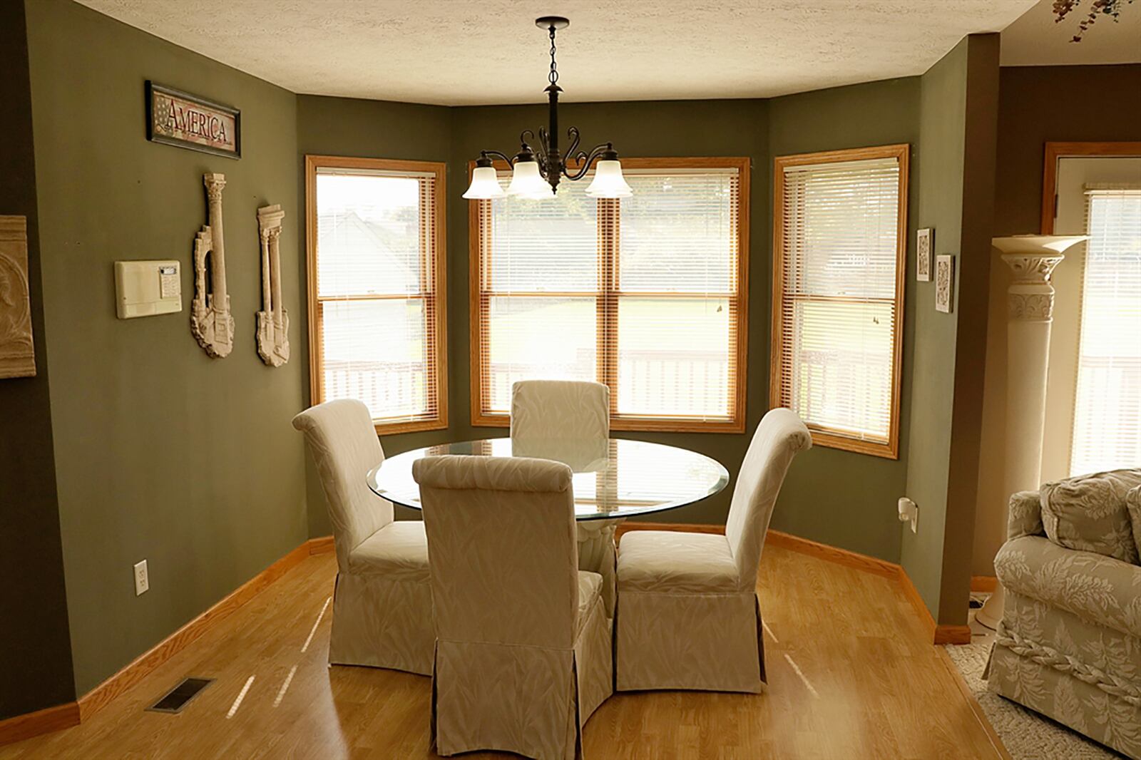 Off the great room is a spacious dining room and kitchen. A bay window creates a sunny dining area. CONTRIBUTED PHOTO BY KATHY TYLER