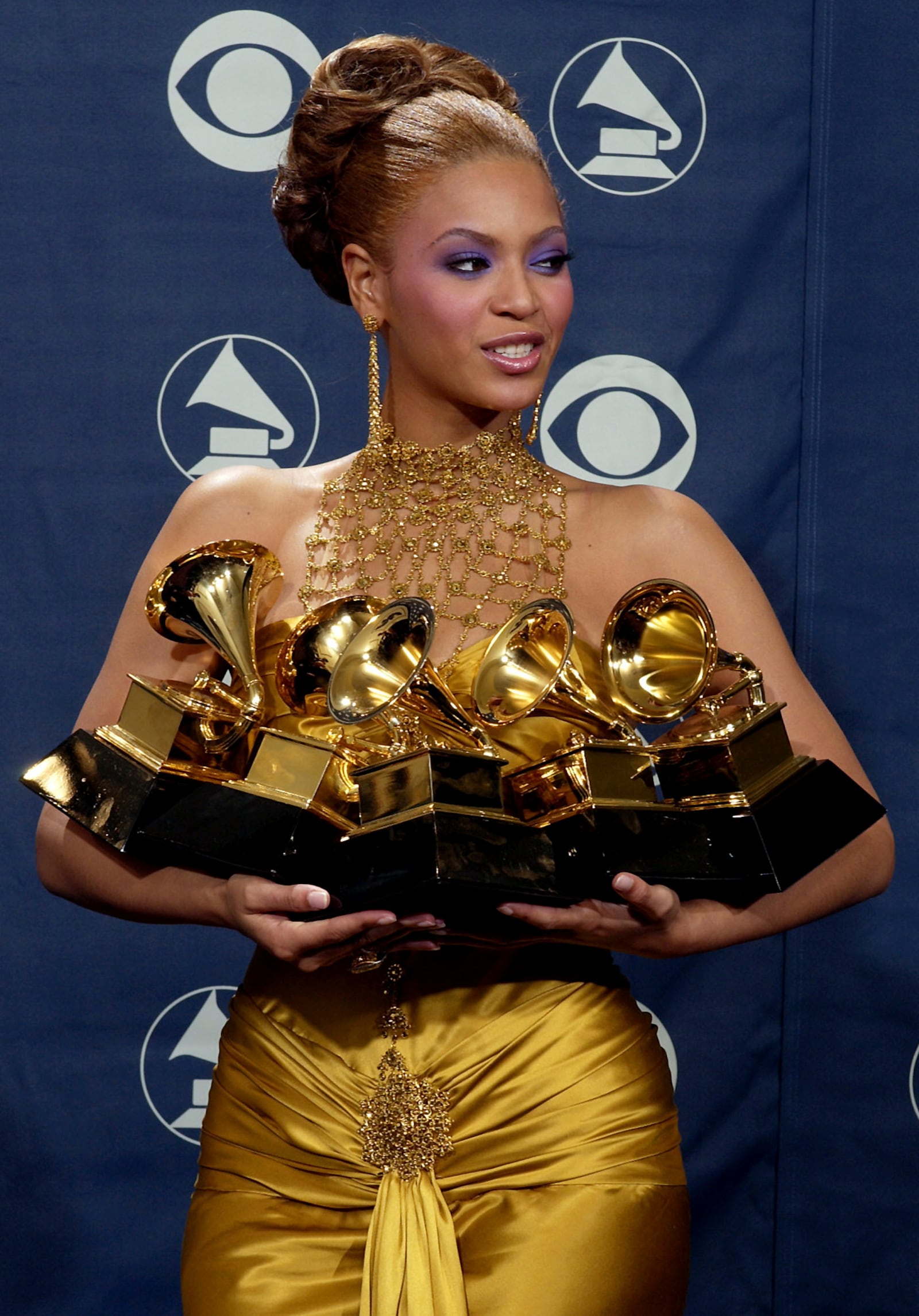 FILE - Beyonce Knowles holds the Grammy awards she won during the 46th Annual Grammy Awards on Feb. 8, 2004, in Los Angeles. (AP Photo/Reed Saxon, File)