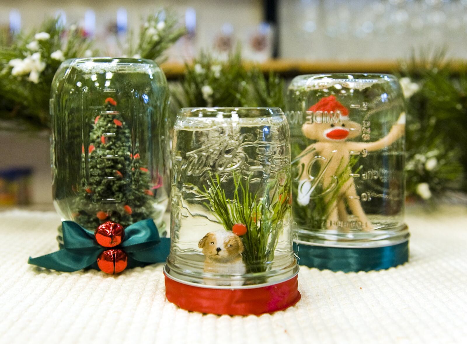 Using a Mason jar, water and glitter, you can create your own snow globe, like these at Zinger Hardware and General Merchant.