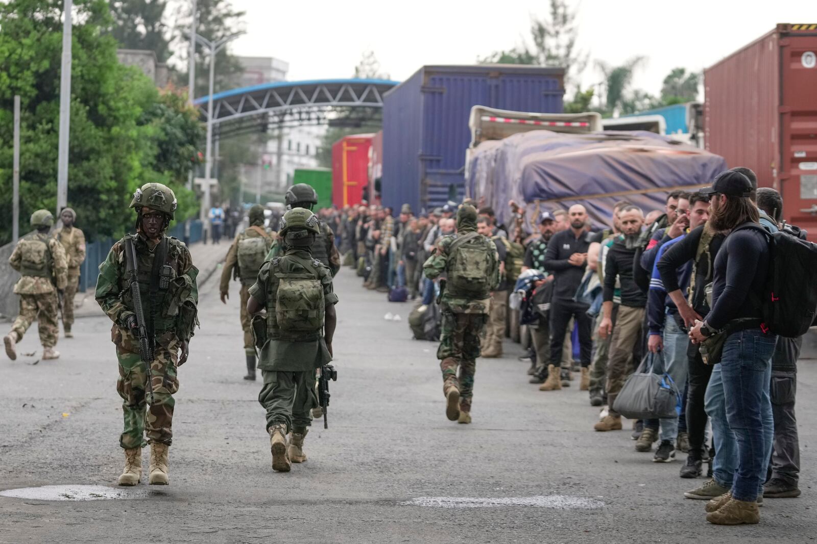 M23 rebels release captured Romanian mercenaries, who were fighting alongside Democratic Republic of Congo army (FRDC), at Gisenyi border point in Congo, Wednesday, Jan. 29, 2025, after the M23 rebels advanced into eastern Congo's capital Goma. (AP Photo/Brian Inganga)