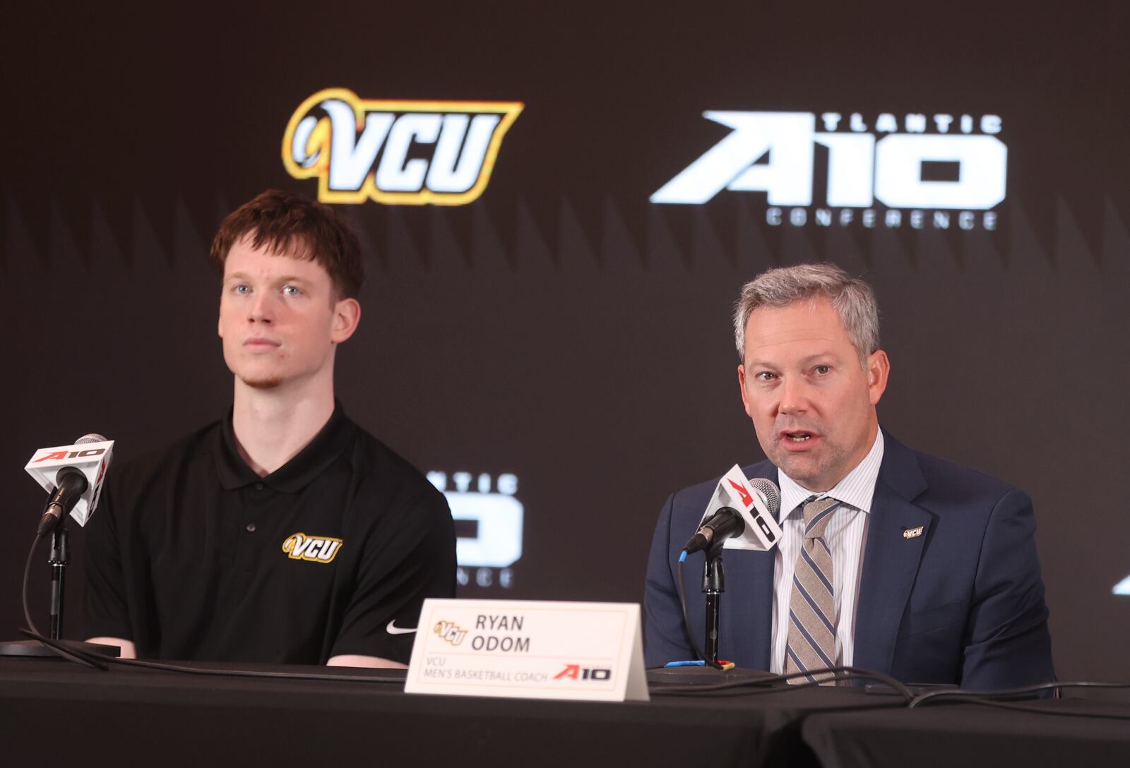 Virginia Commonwealth's Ryan Odom, right, and Max Shulga speak at Atlantic 10 Conference Media Day on Monday, Oct. 7, 2024, at District E next to Capital One Arena in Washington, D.C. David Jablonski/Staff