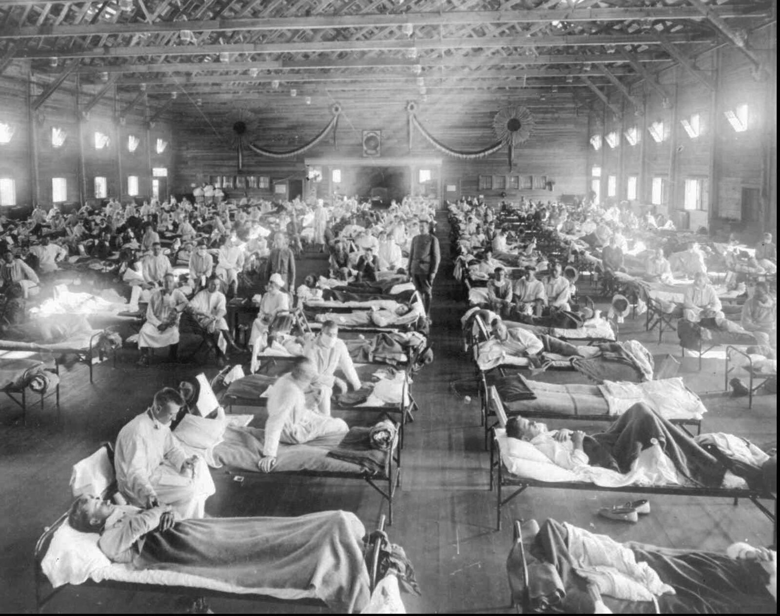 In this 1918 photograph, influenza victims crowd into an emergency hospital at Camp Funston, a subdivision of Fort Riley in Kansas. The flu, which is believed to have originated in Kansas, killed from 20 to 50 million people worldwide.